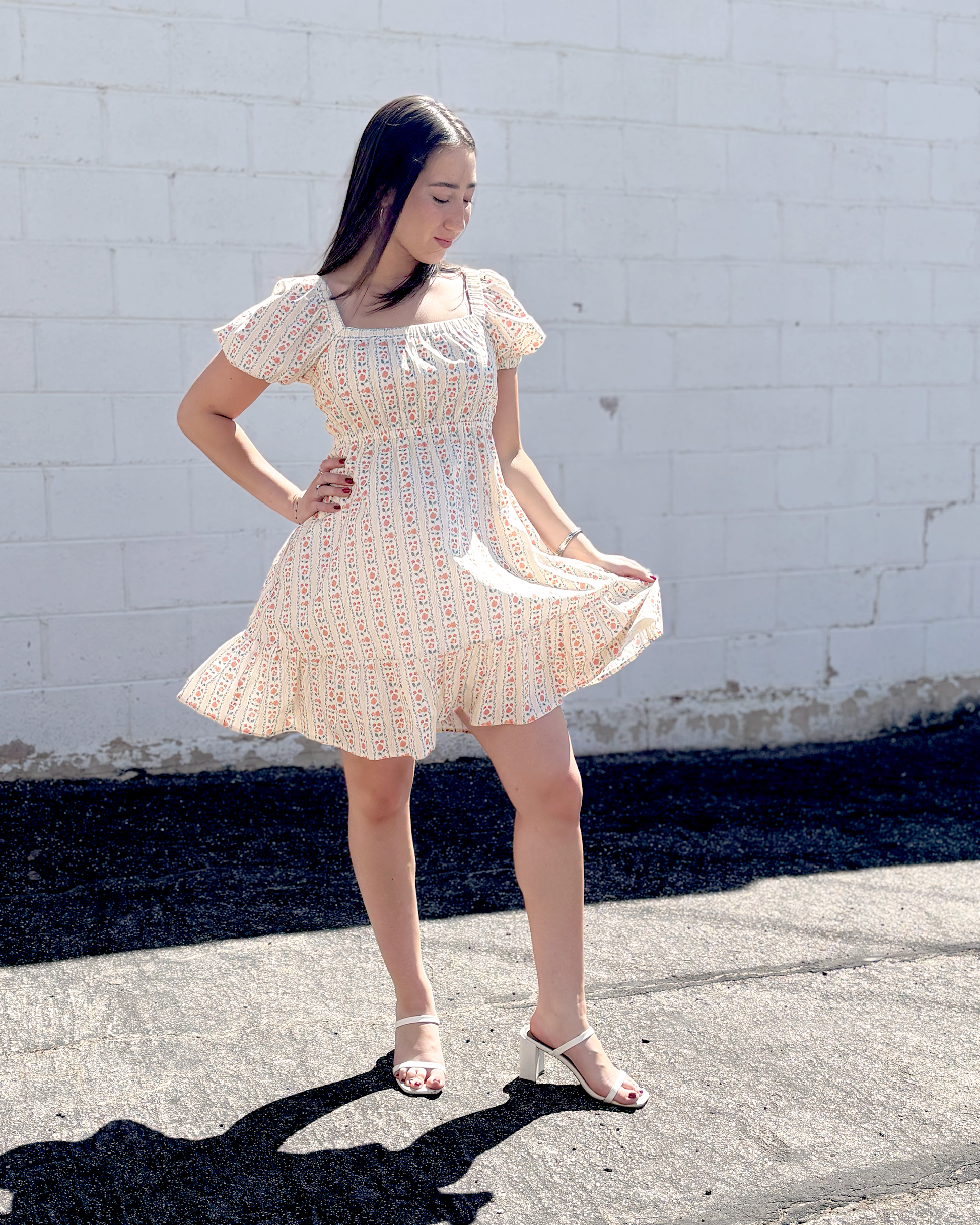 Short floral summer dress with puff sleeves and an empire waist
