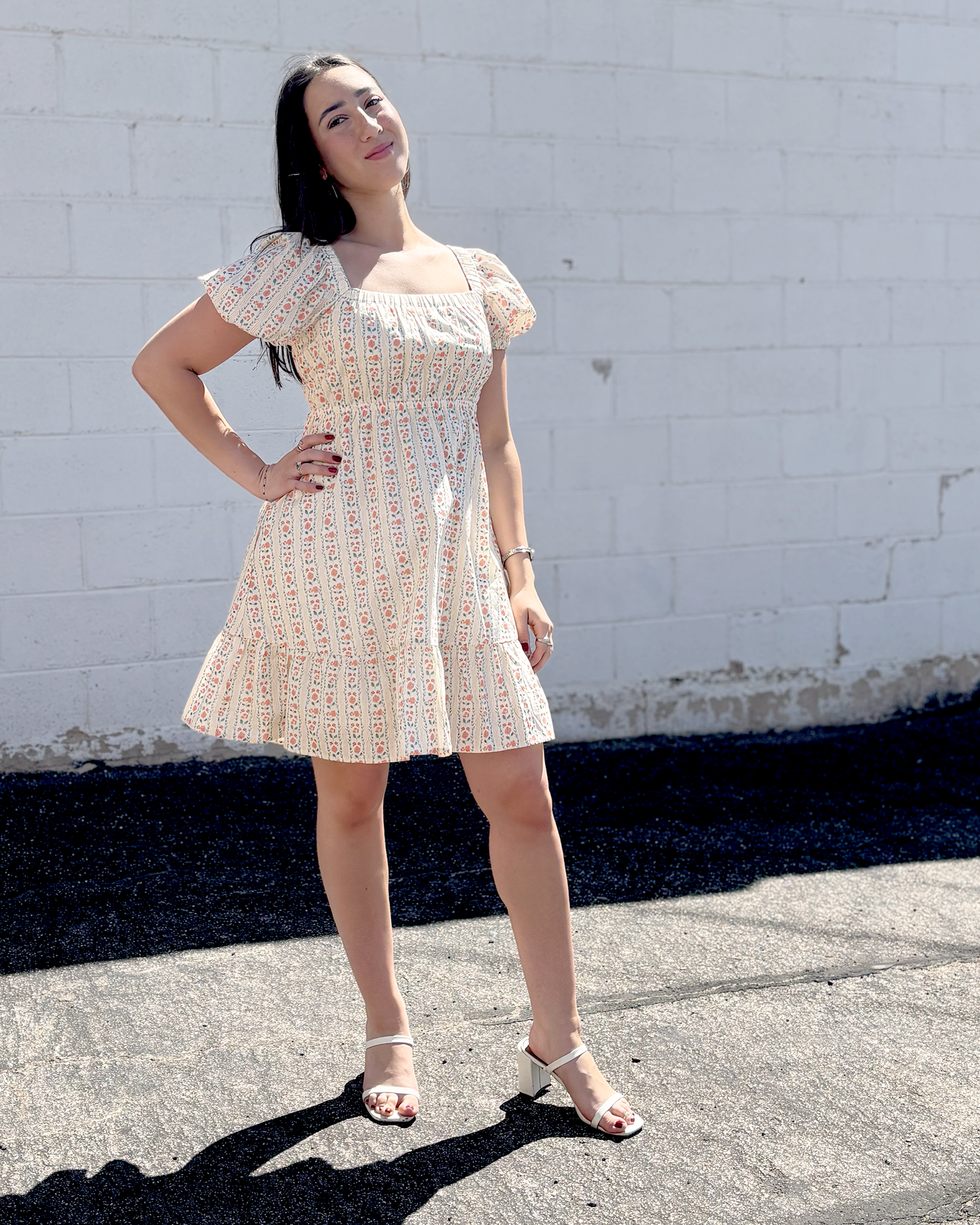 Short floral summer dress with puff sleeves and an empire waist