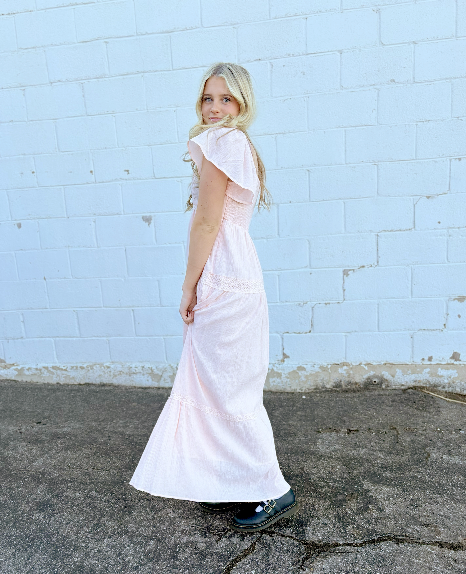 Pink gauze dress with lace details and flutter sleeve