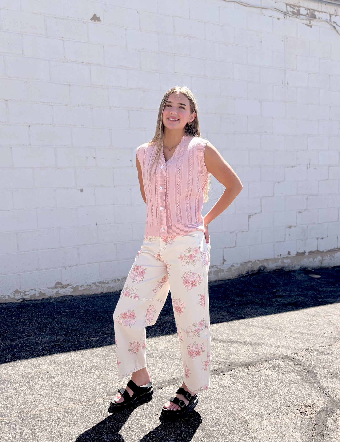 Ivory jeans with pink floral print all over and a slight barrel shape