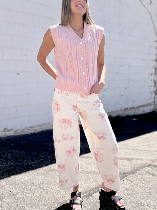 Ivory jeans with pink floral print all over and a slight barrel shape