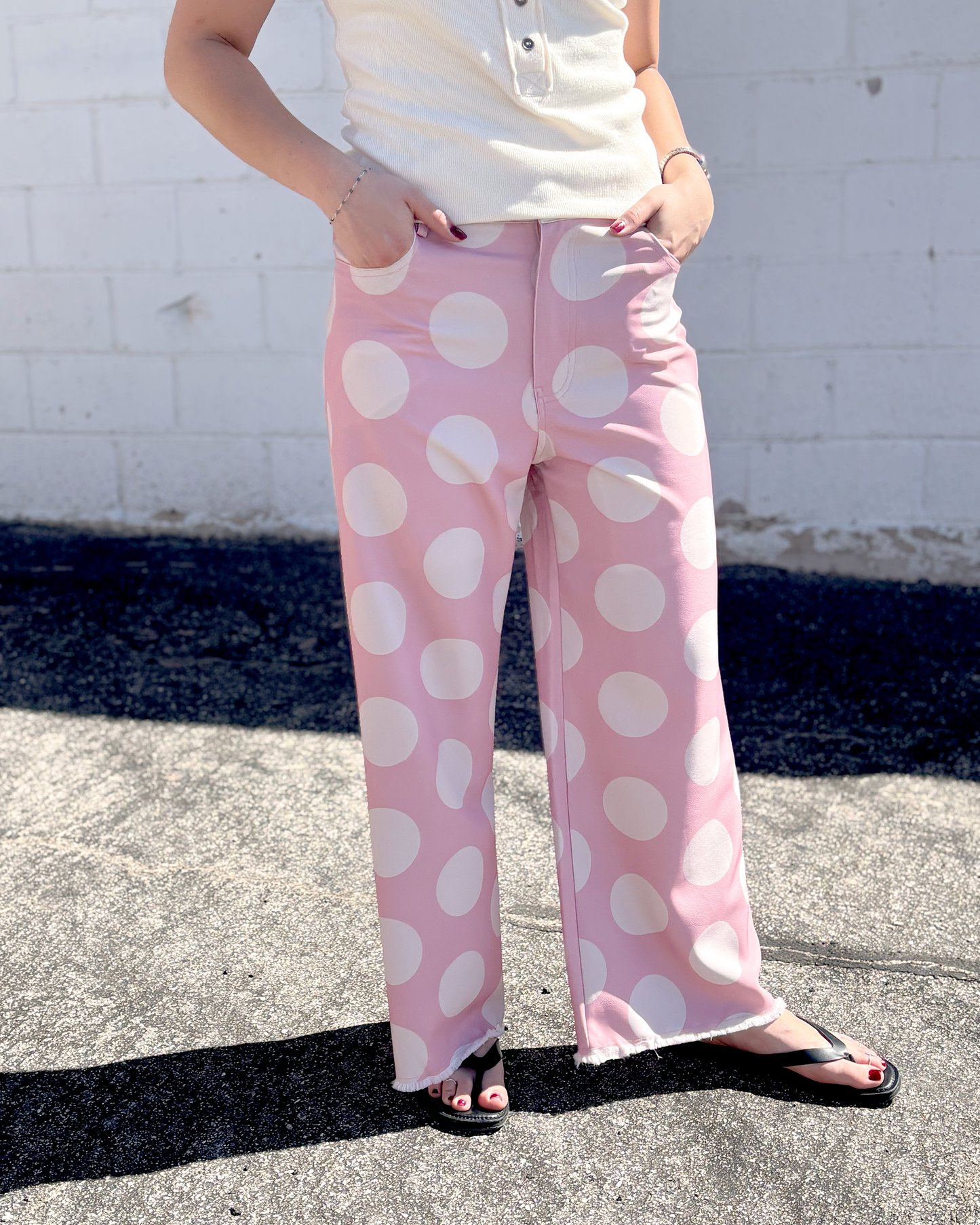 Pink wide leg pats with a big white polka dot print