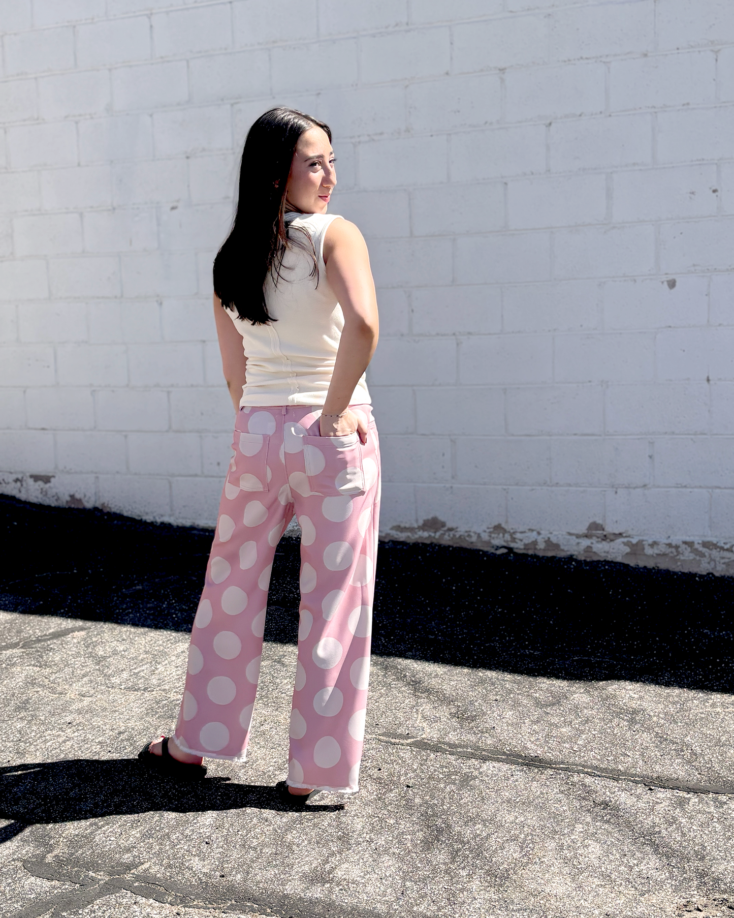 Pink wide leg pats with a big white polka dot print