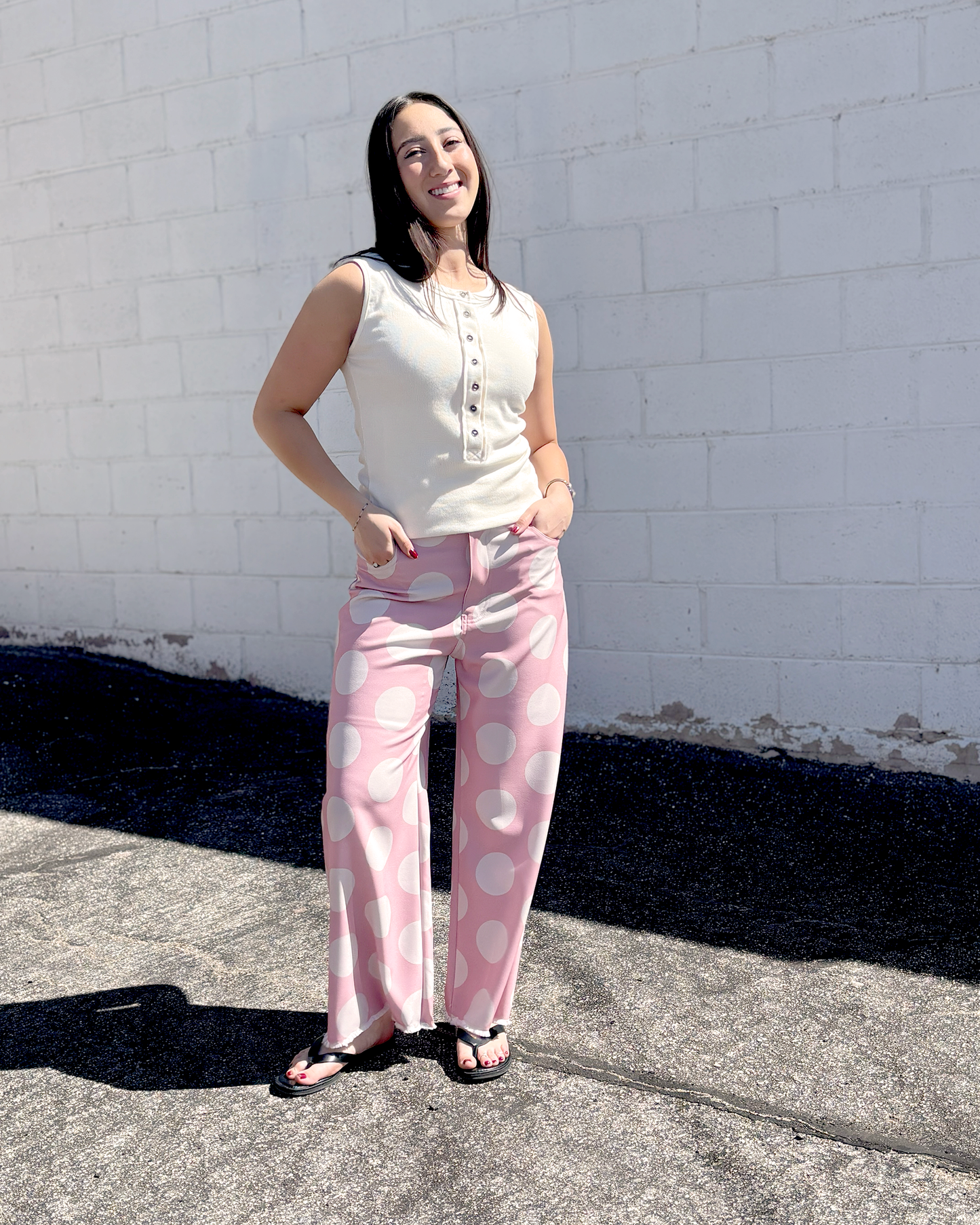 Pink wide leg pats with a big white polka dot print