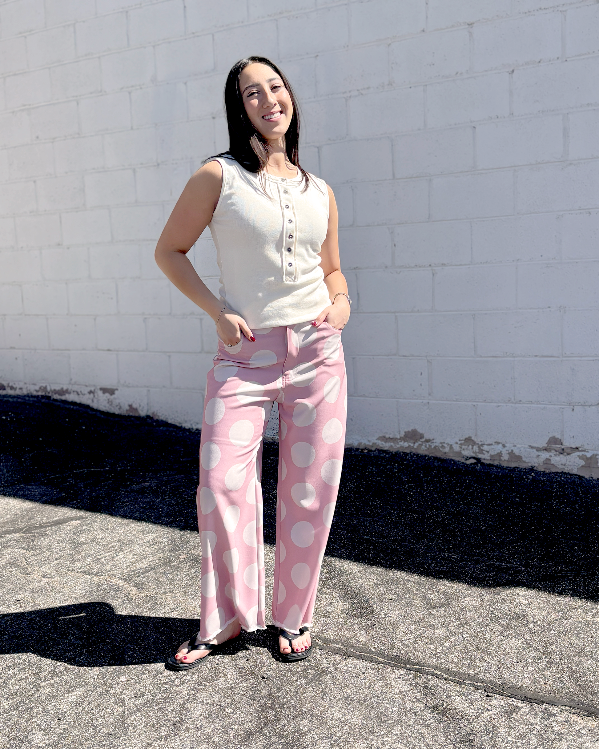 Pink wide leg pats with a big white polka dot print
