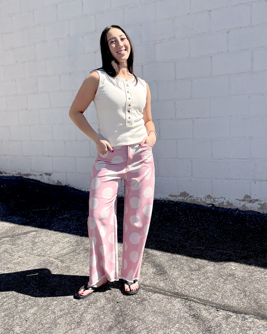 Pink wide leg pats with a big white polka dot print