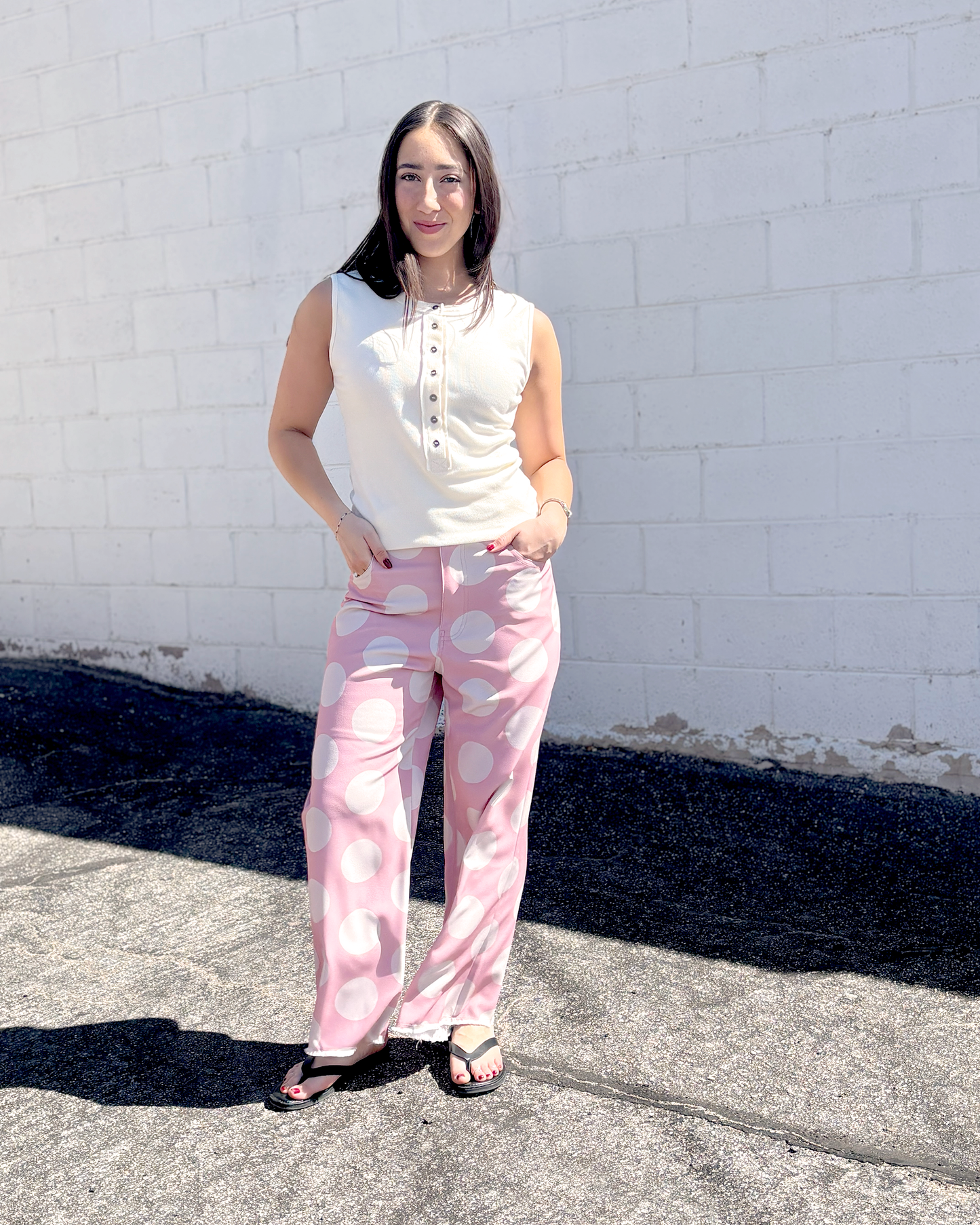 Pink wide leg pats with a big white polka dot print