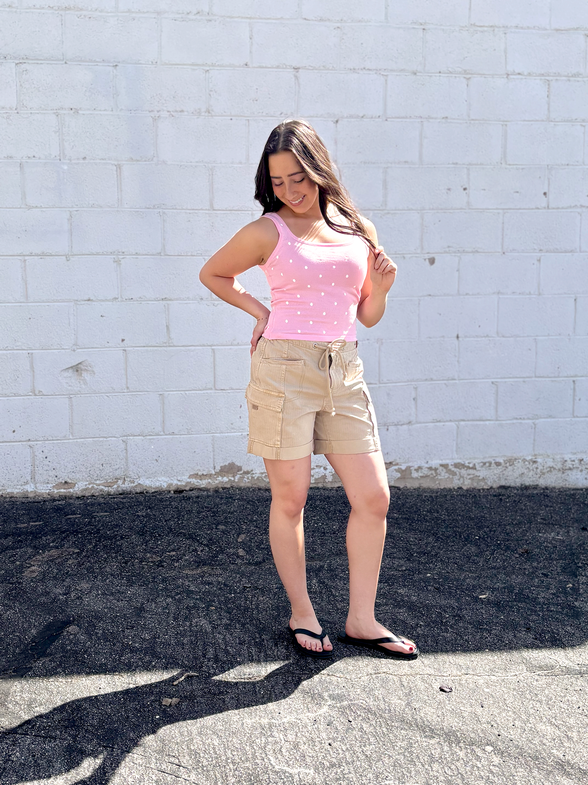 pink tank top with small white polka dots