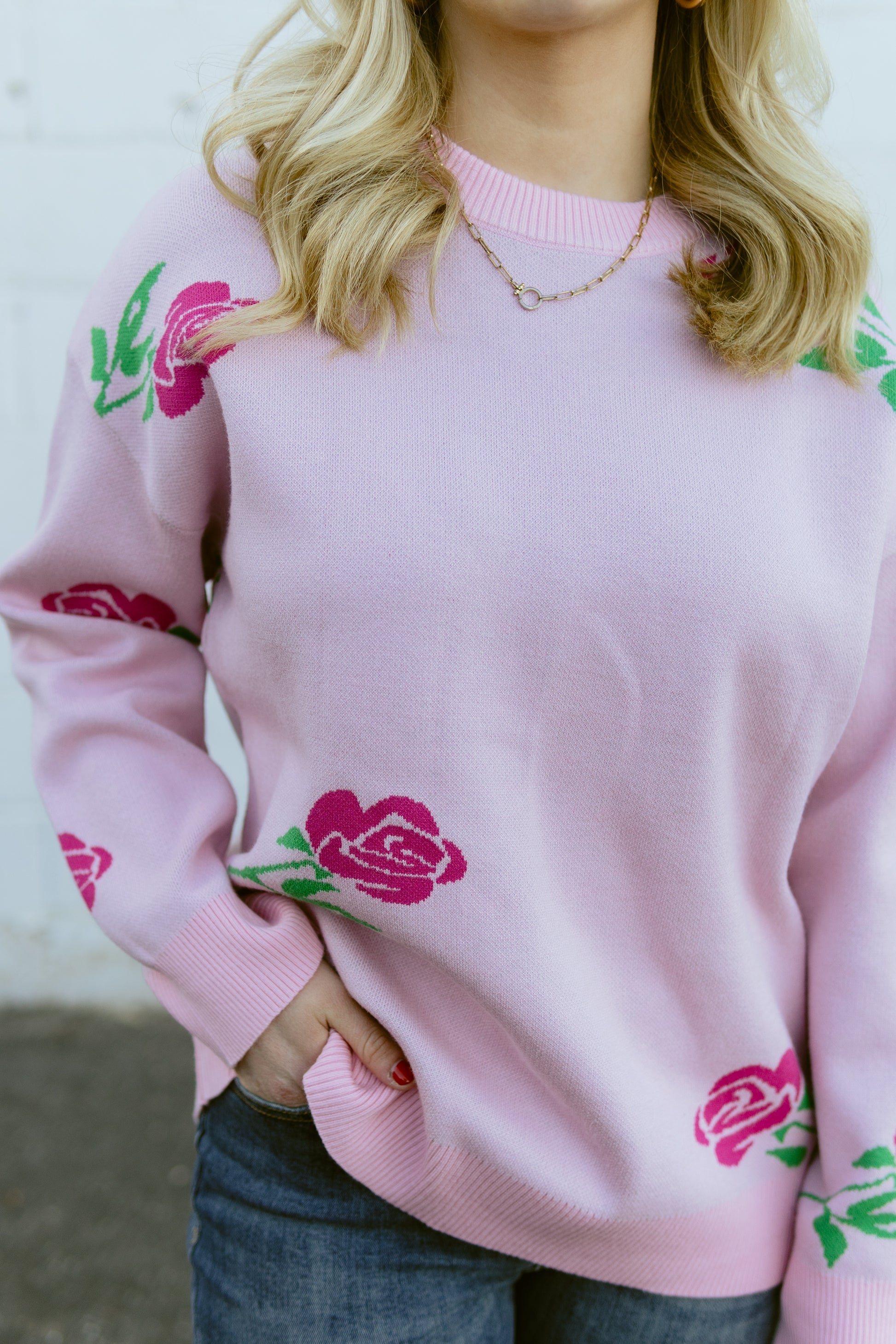 Pink crew neck sweater with hot pink roses