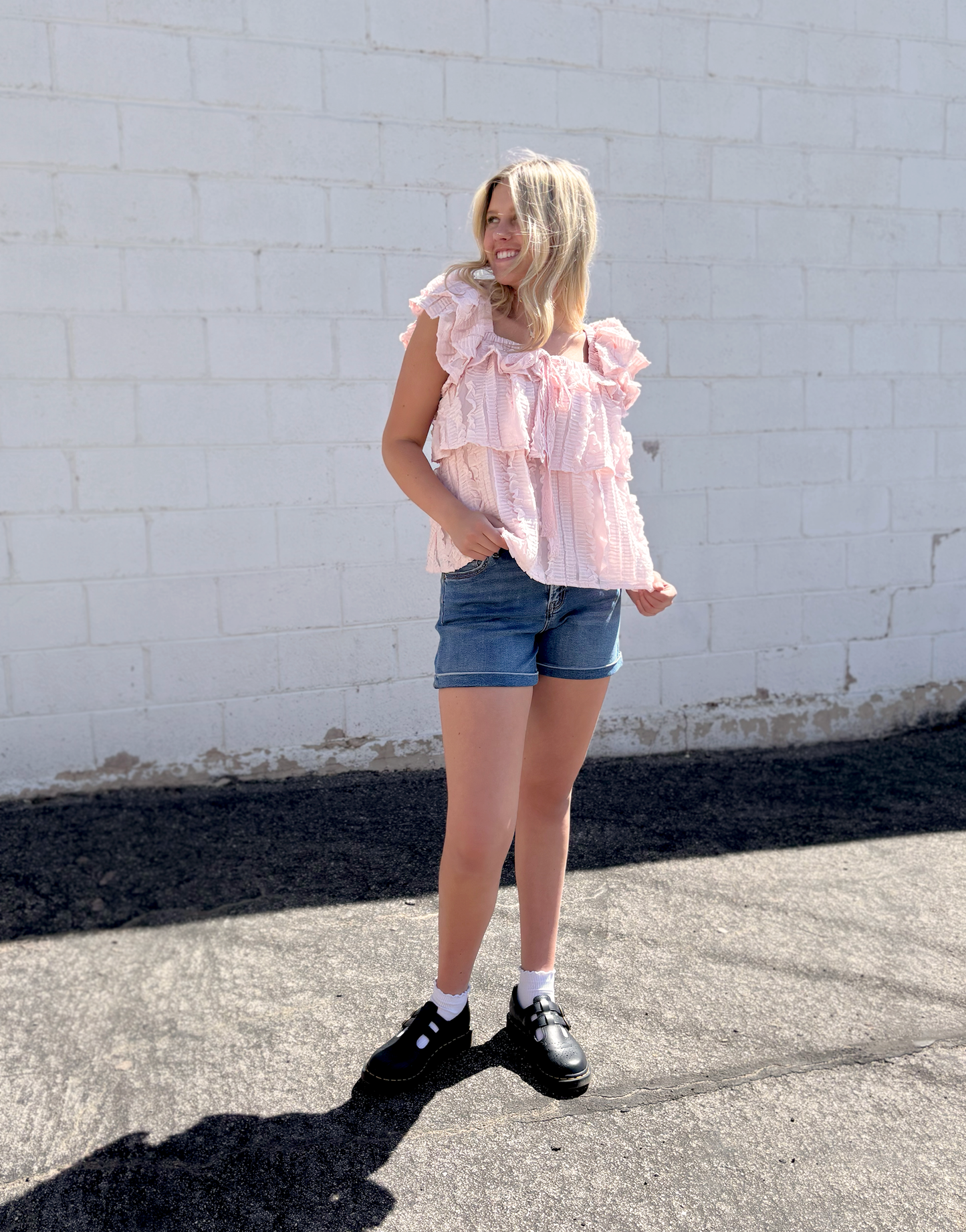 Cute pink ruffled top with tiered ruffles and bow