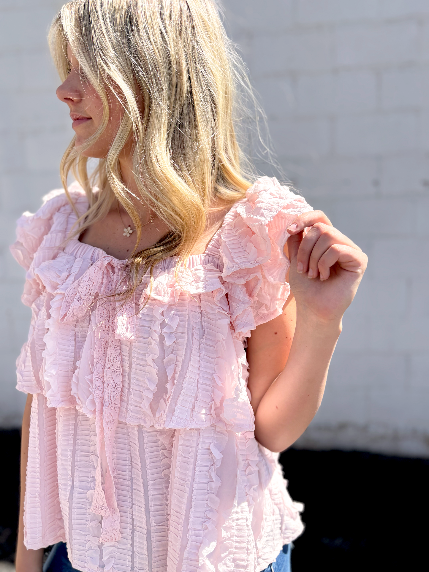 Cute pink ruffled top with tiered ruffles and bow