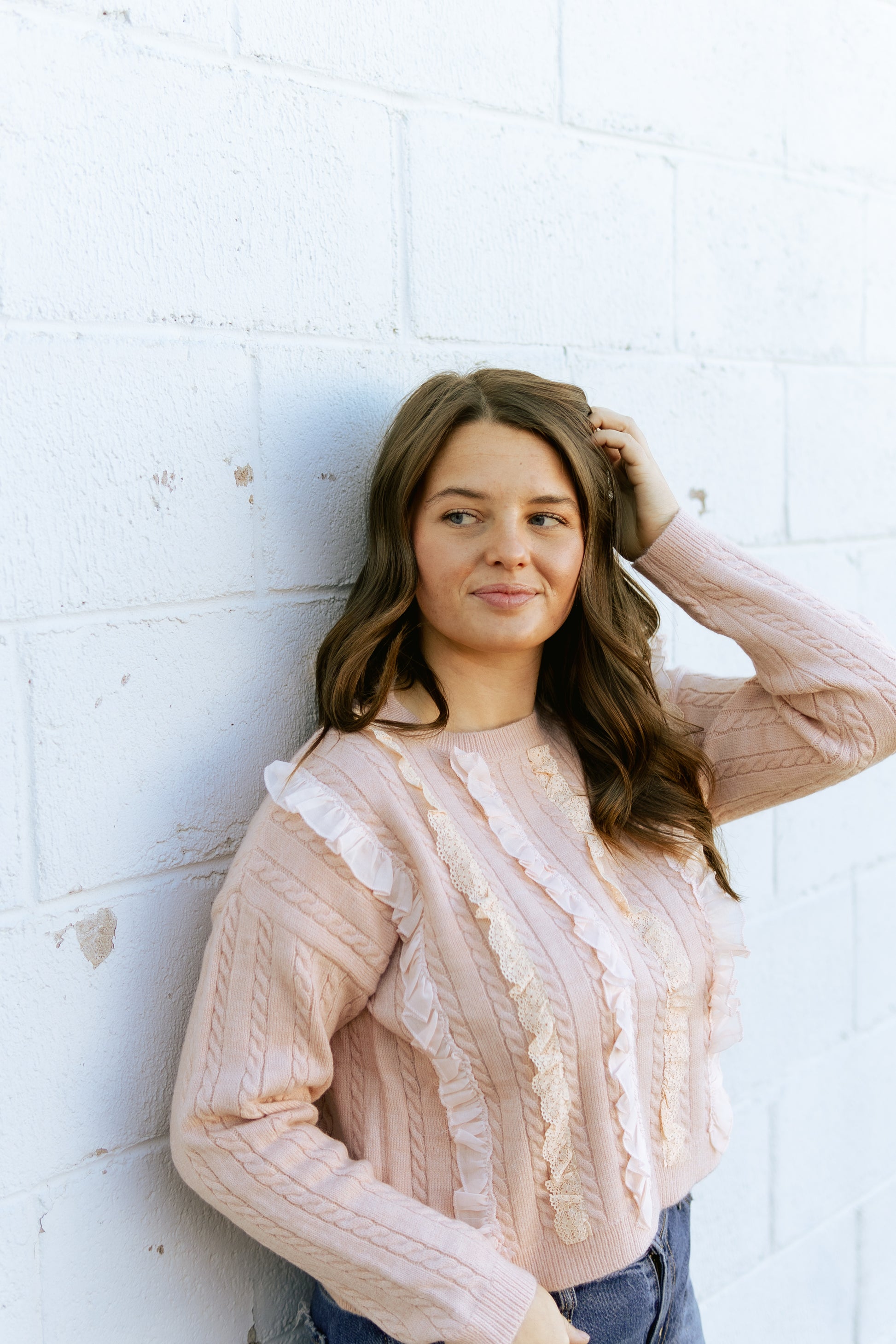 Pink ruffle top with cable knit detail