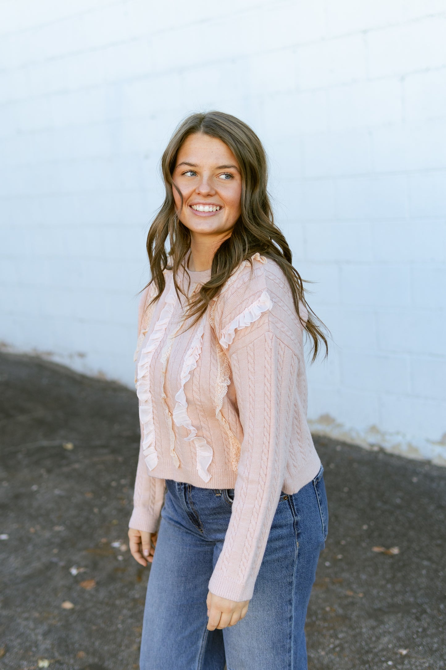 Pink ruffle top with cable knit detail