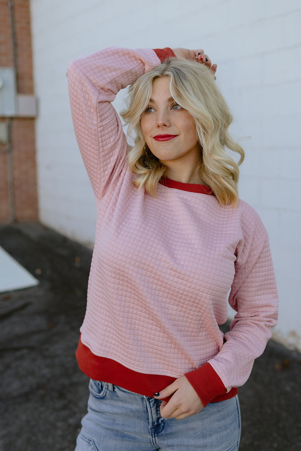 pink quilted sweater with maroon trim