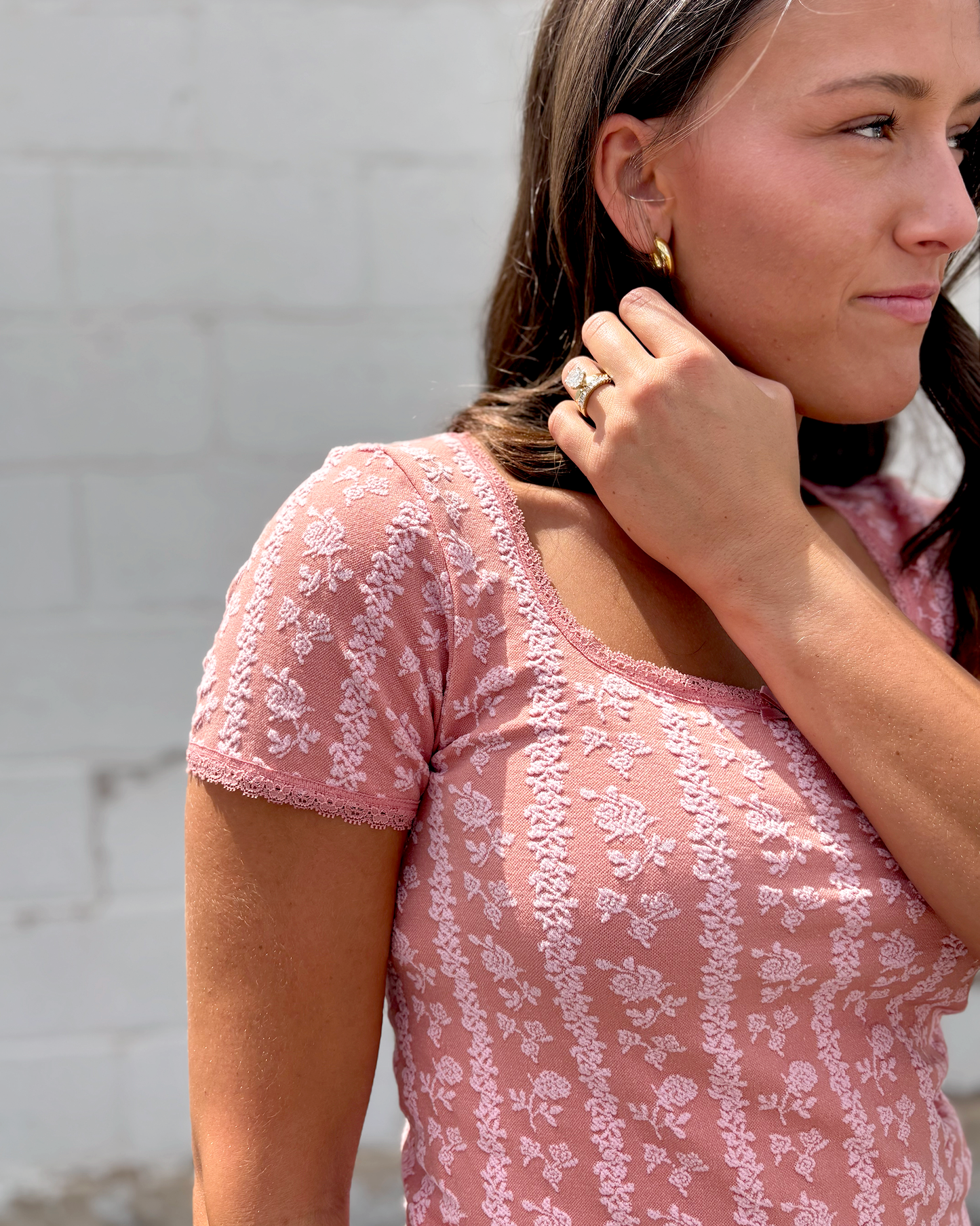 Pink square neck top with light pink floral pattern over top