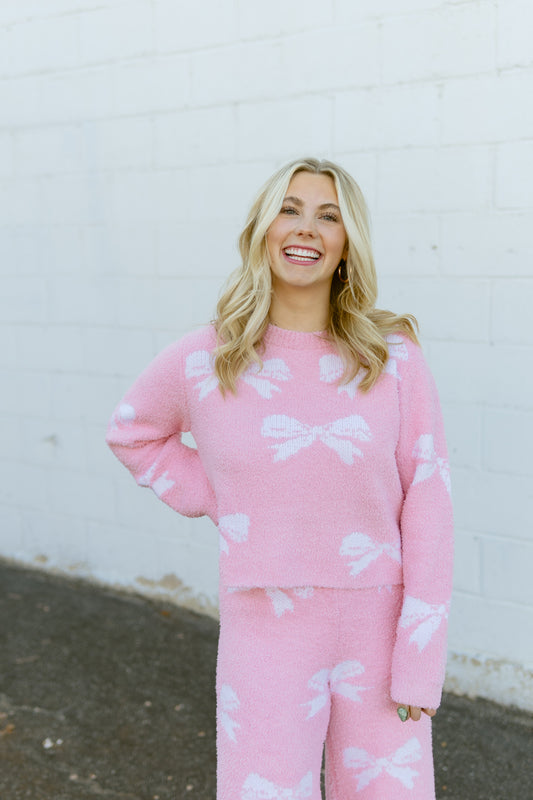 Pink set with sweater and pants with bow print