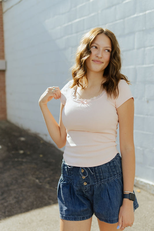 cute pink tee with lace detail along the collar