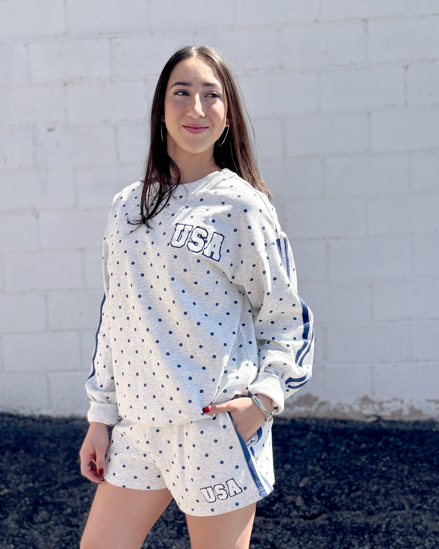 Grey sweatshirt with navy polka dots and USA embroidered on the front