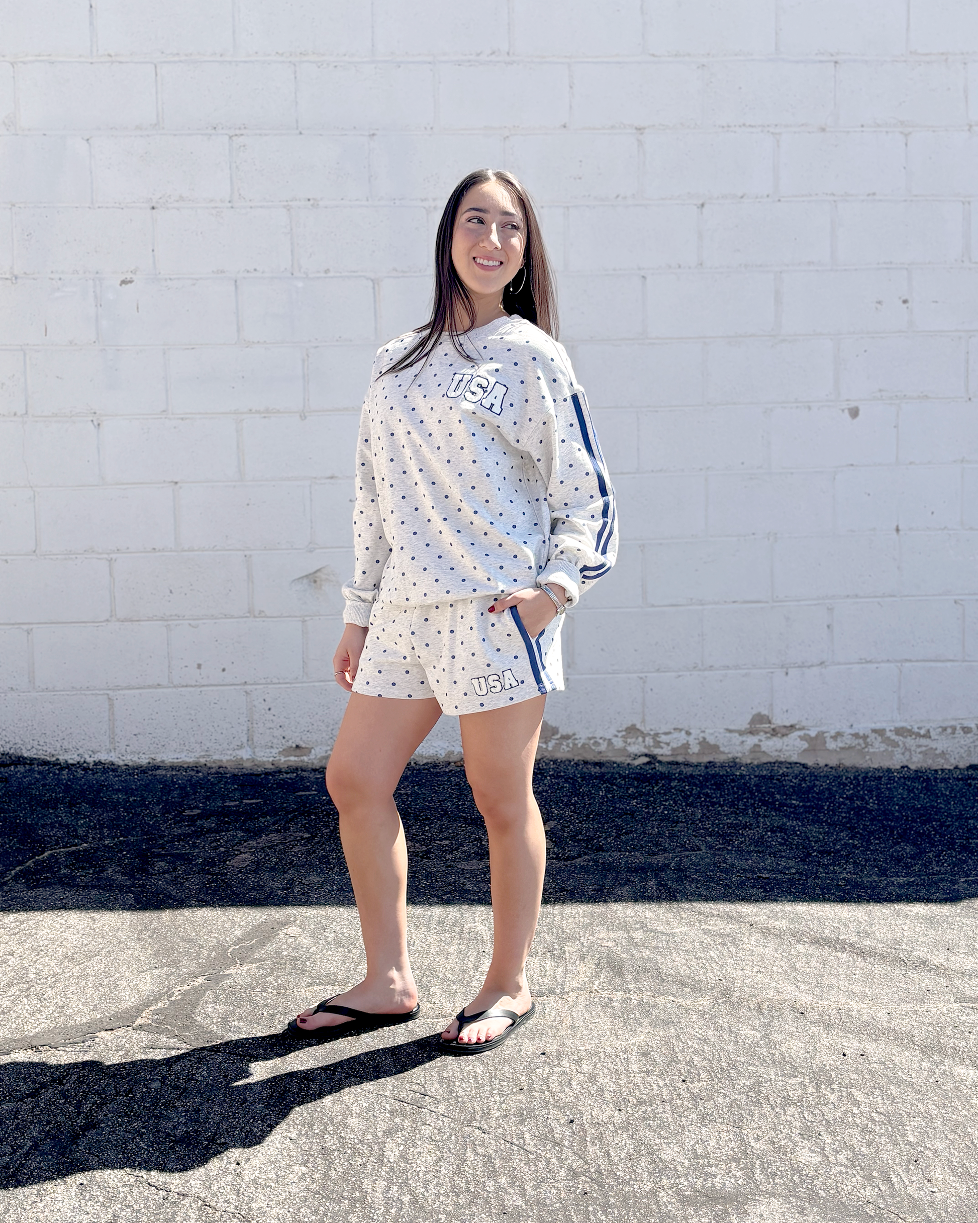 Grey sweatshirt with navy polka dots and USA embroidered on the front