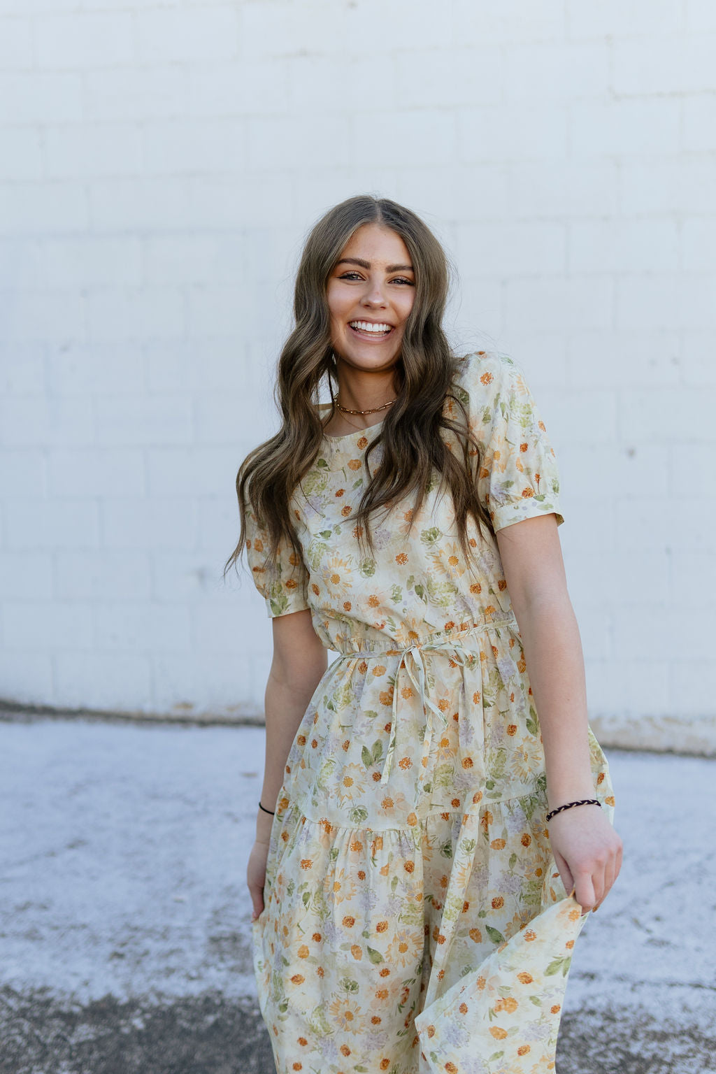 Soft yellow floral dress with tie around waist