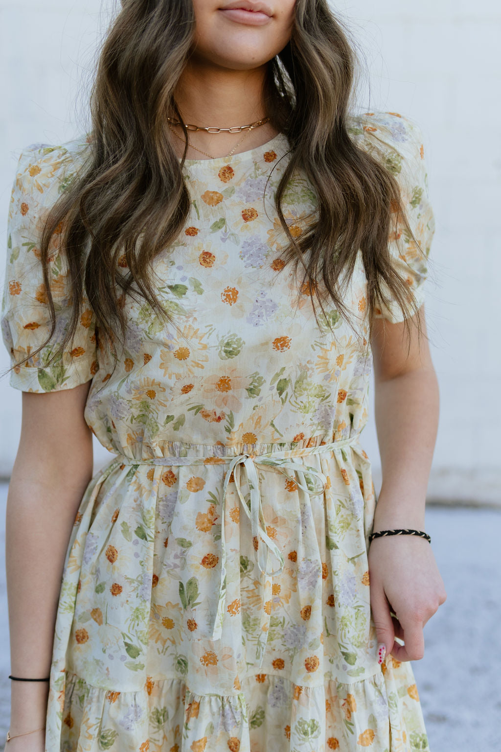 Soft yellow floral dress with tie around waist