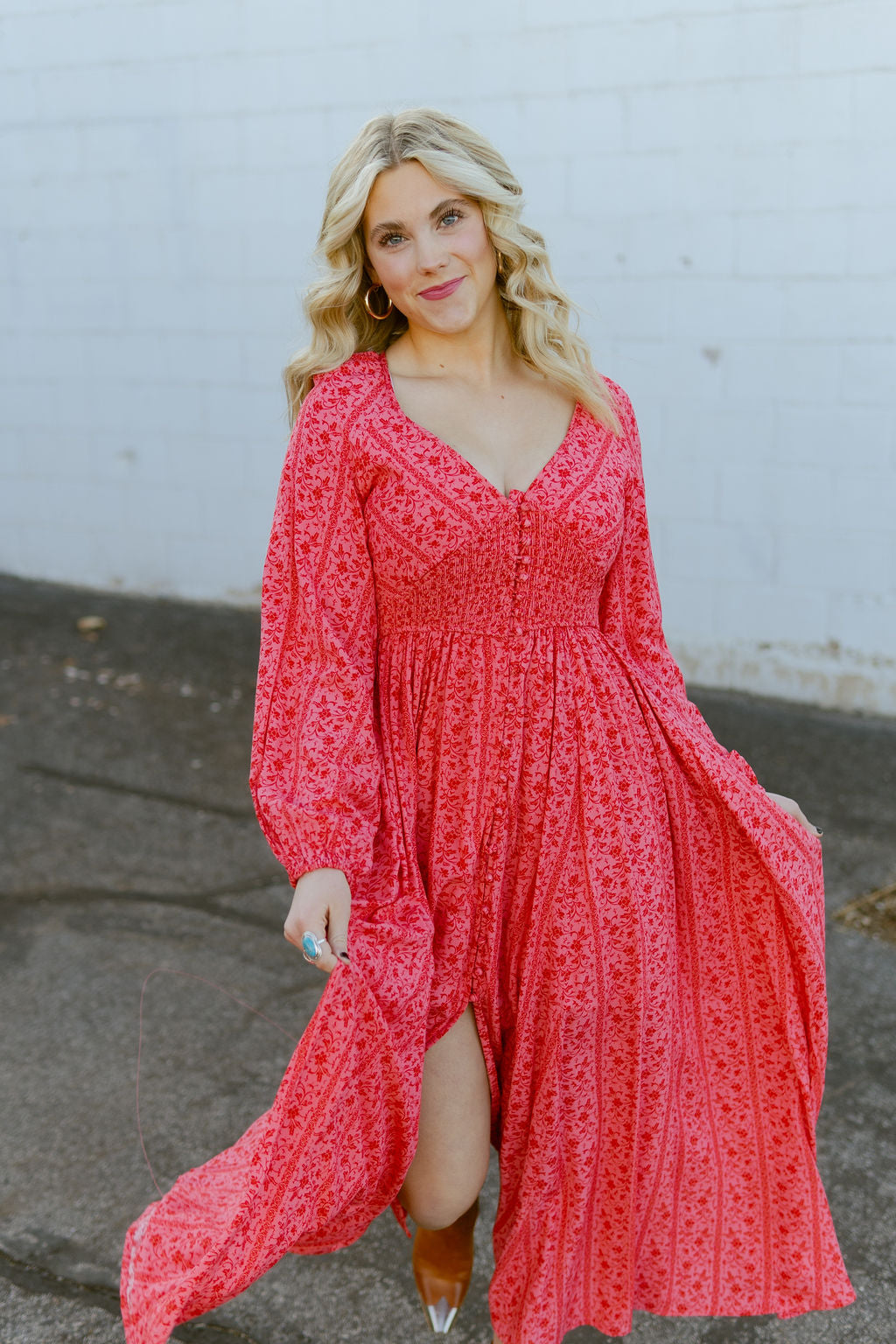 Pink dress with red floral pattern all over