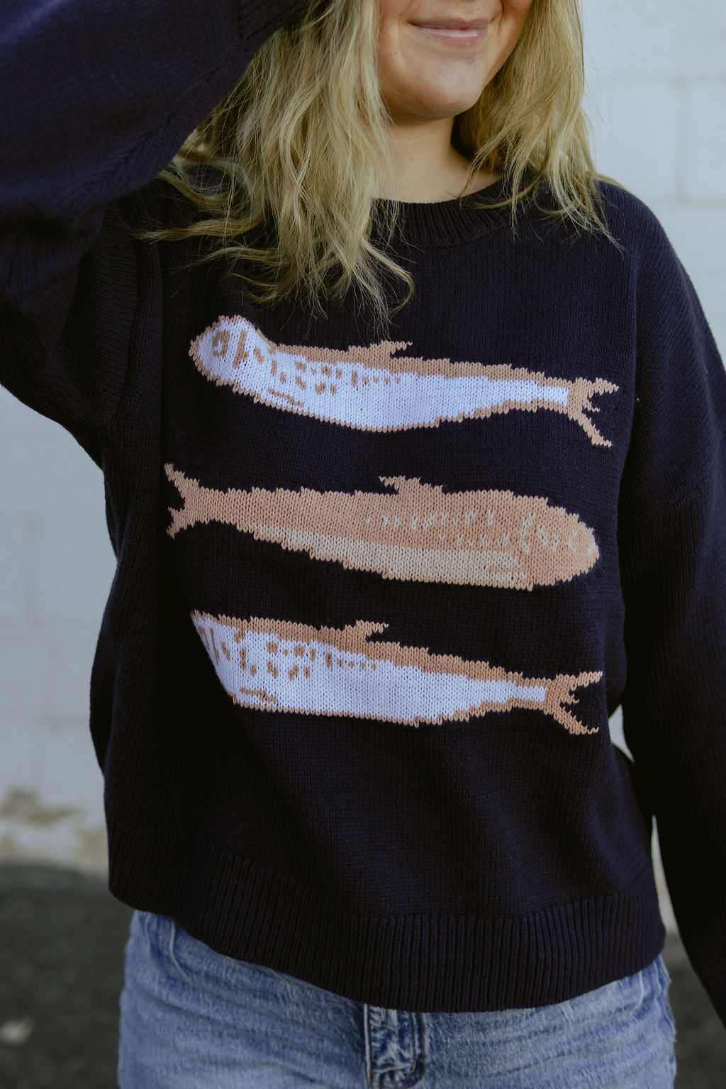 navy sweater with pink sardines