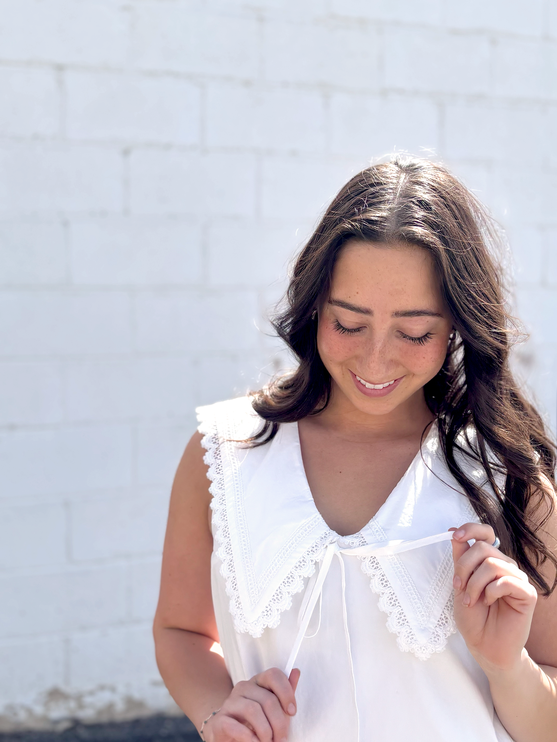 Cute white sleeveless dress with sailor's collar, short with ruffles