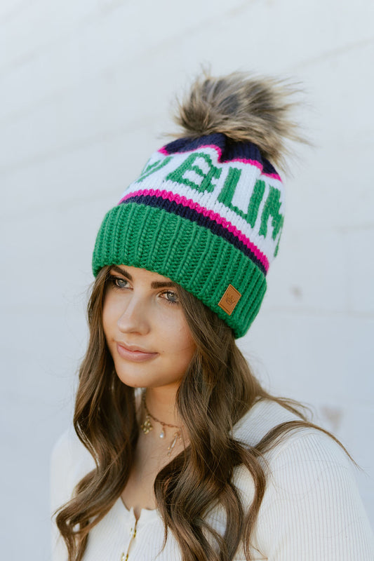 Beanie with Ski Bum knitted pattern with fur ball on top