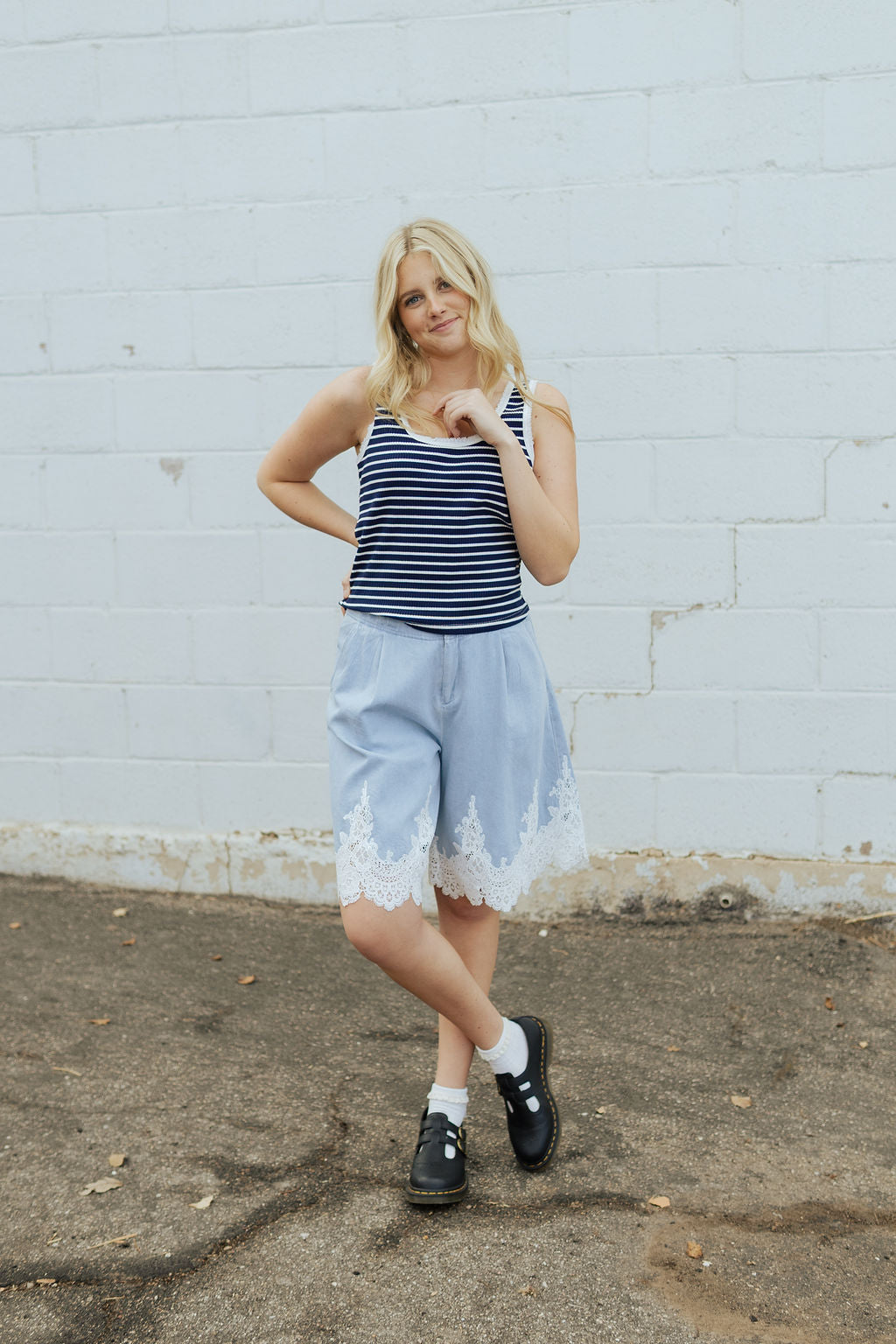 Soft denim shorts with lace trim along the bottom