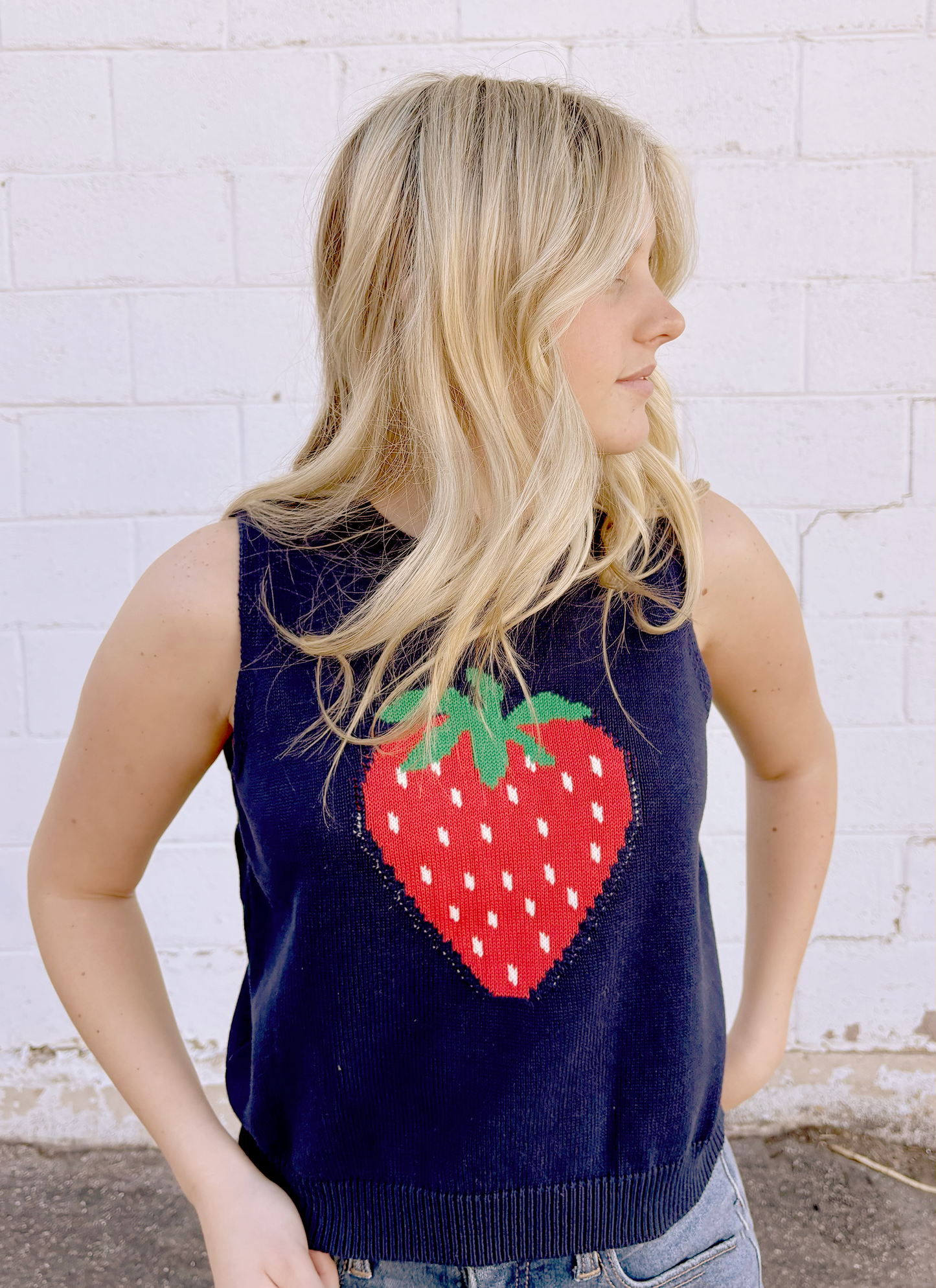 Cute sleeveless sweater with strawberry on the front