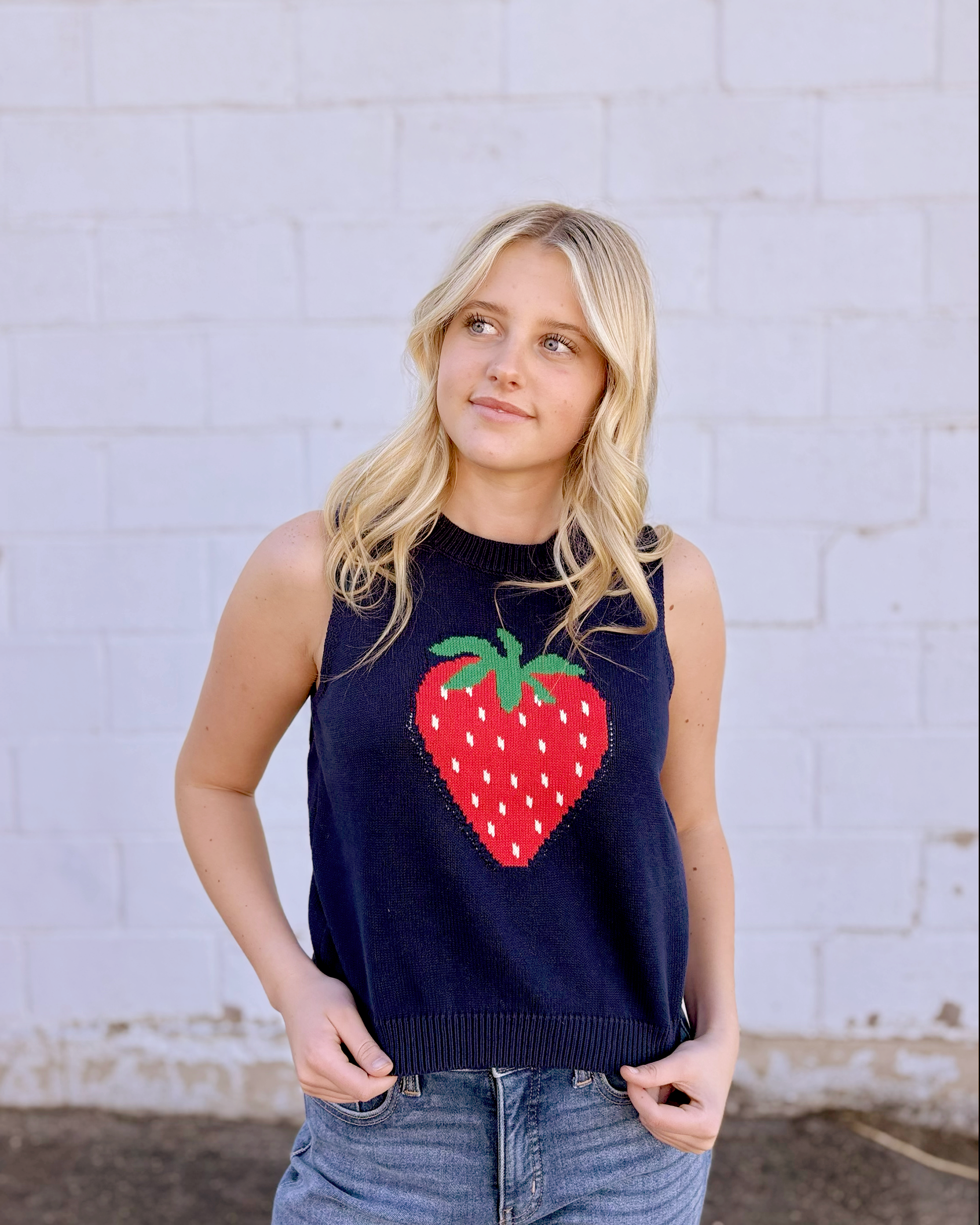 Cute sleeveless sweater with strawberry on the front