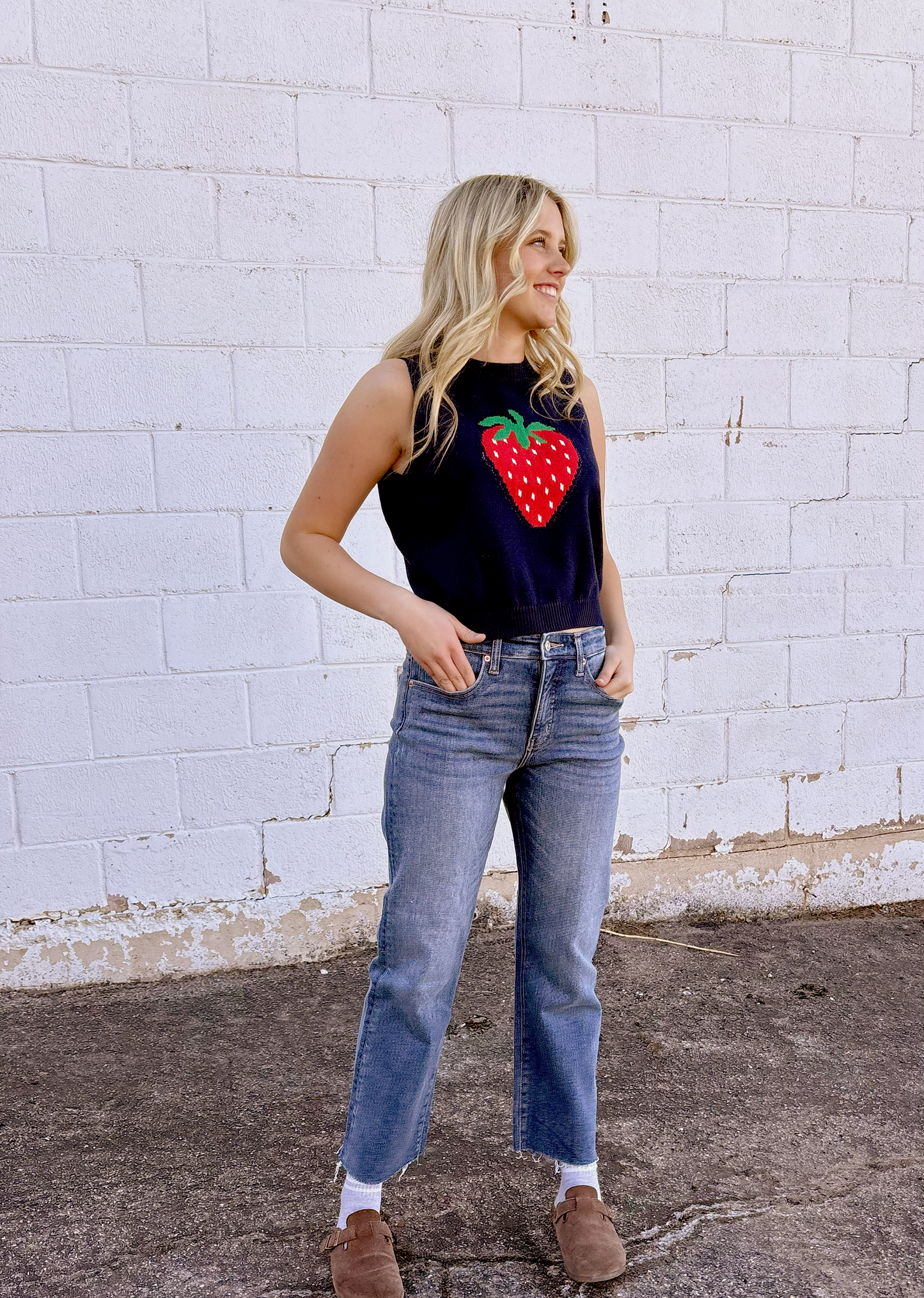 Cute sleeveless sweater with strawberry on the front