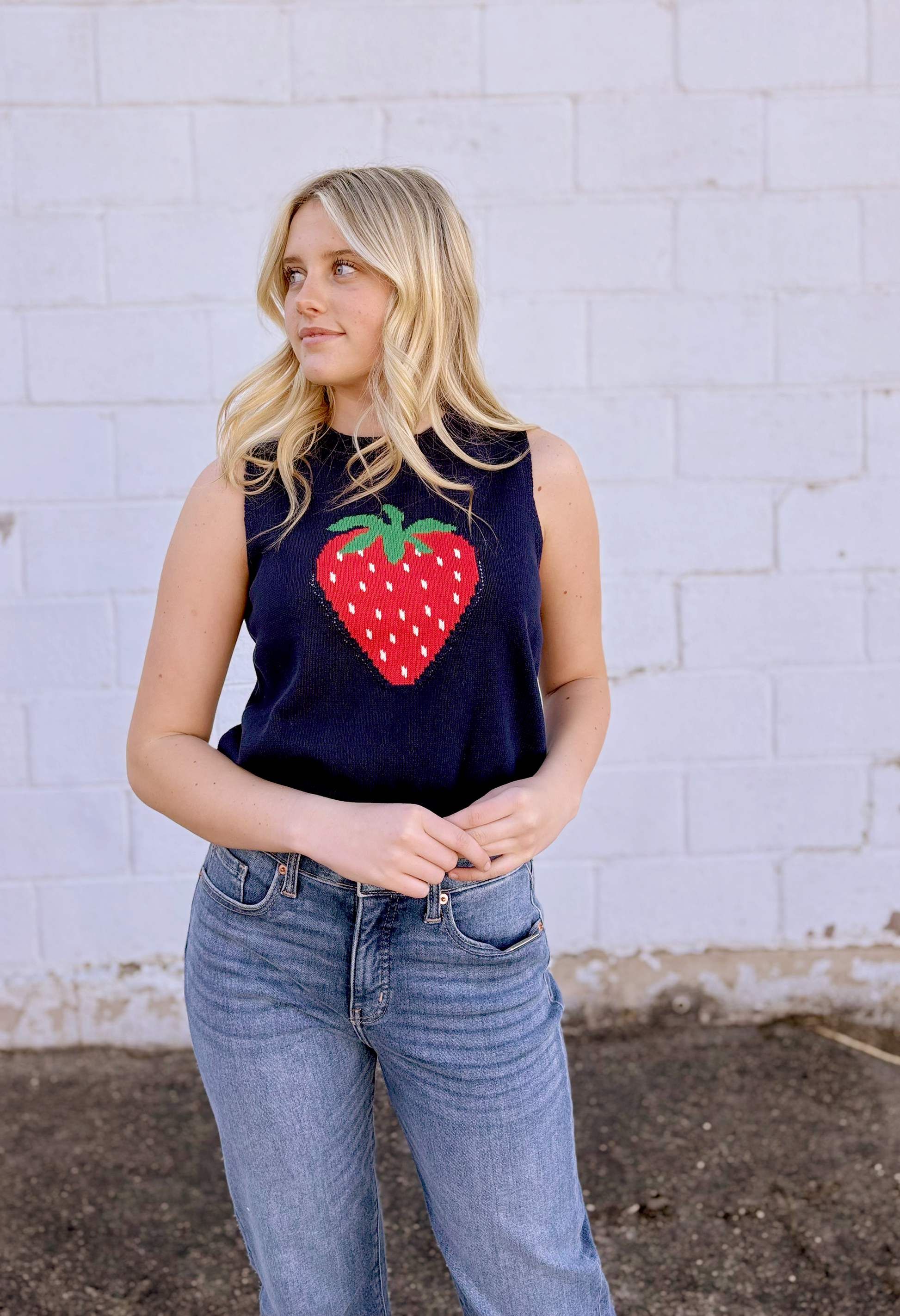 Cute sleeveless sweater with strawberry on the front