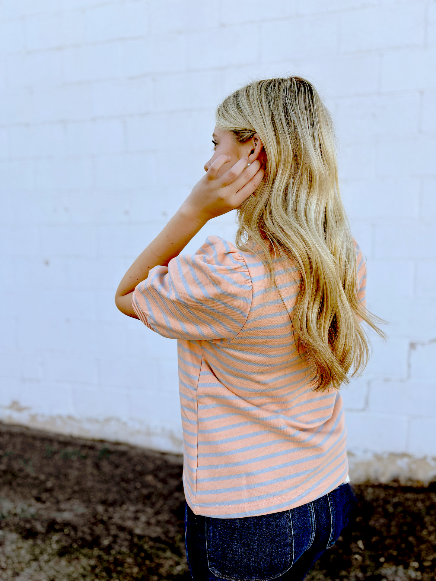 Blush colored tee with grey stripes and puff sleeves