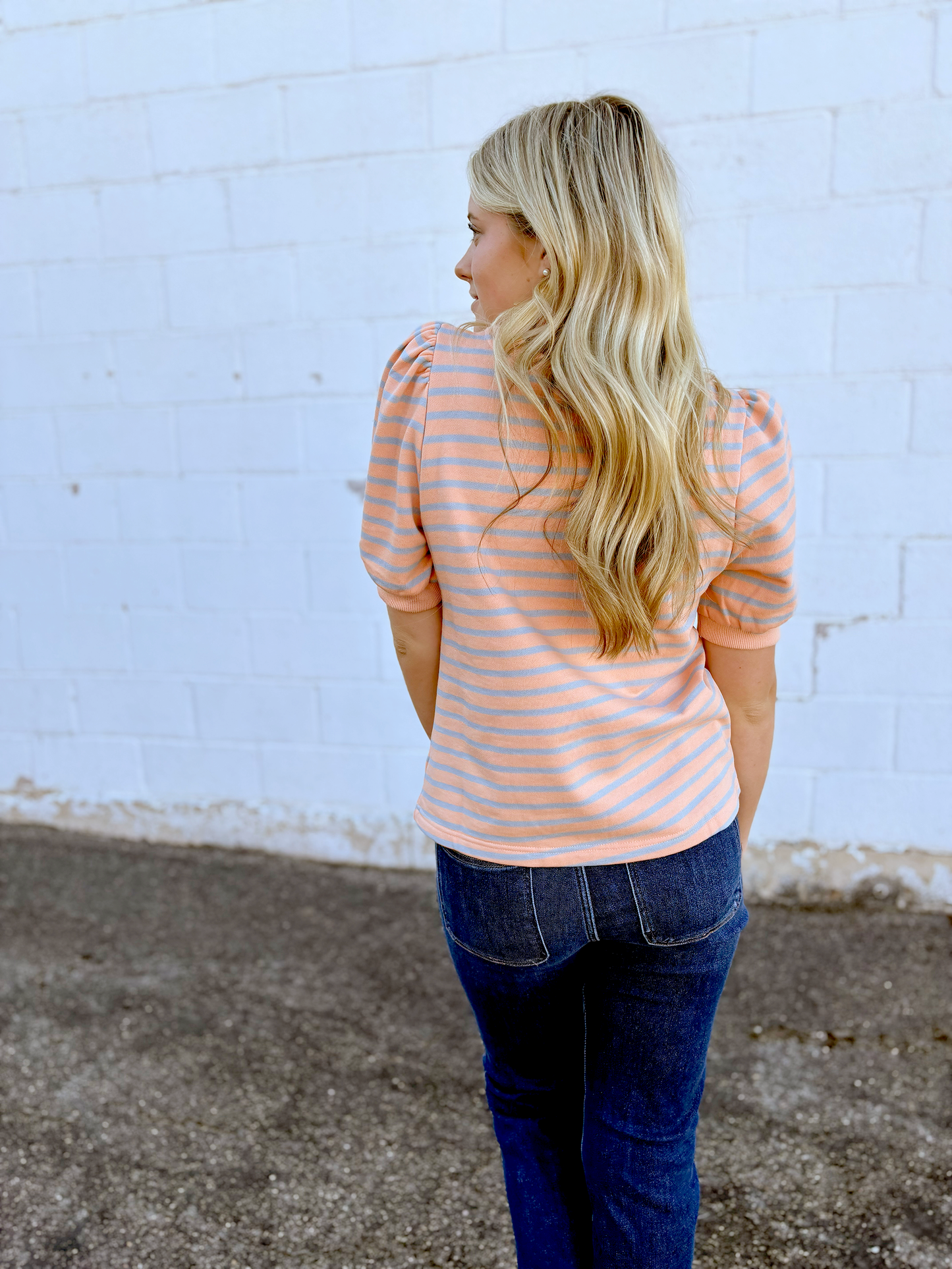 Blush colored tee with grey stripes and puff sleeves