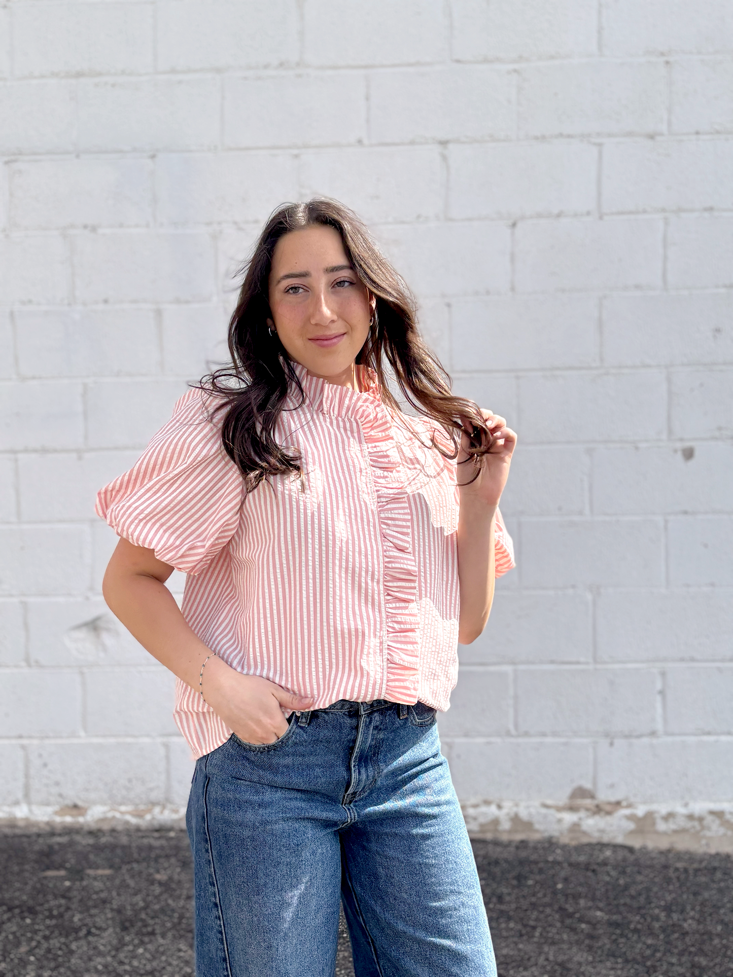 Pink striped button up top with puff sleeves and ruffles up the front and collar
