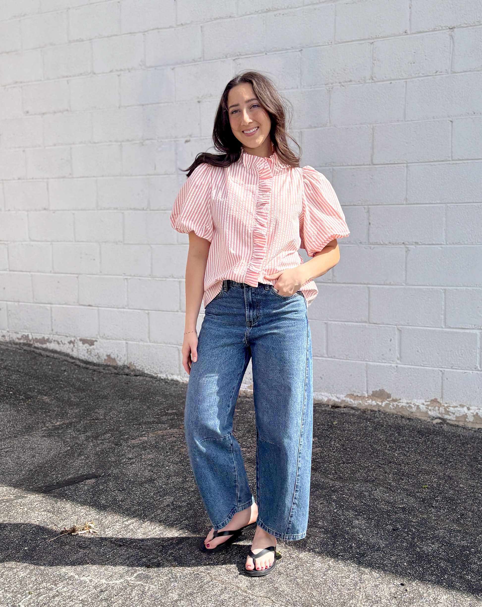 Pink striped button up top with puff sleeves and ruffles up the front and collar