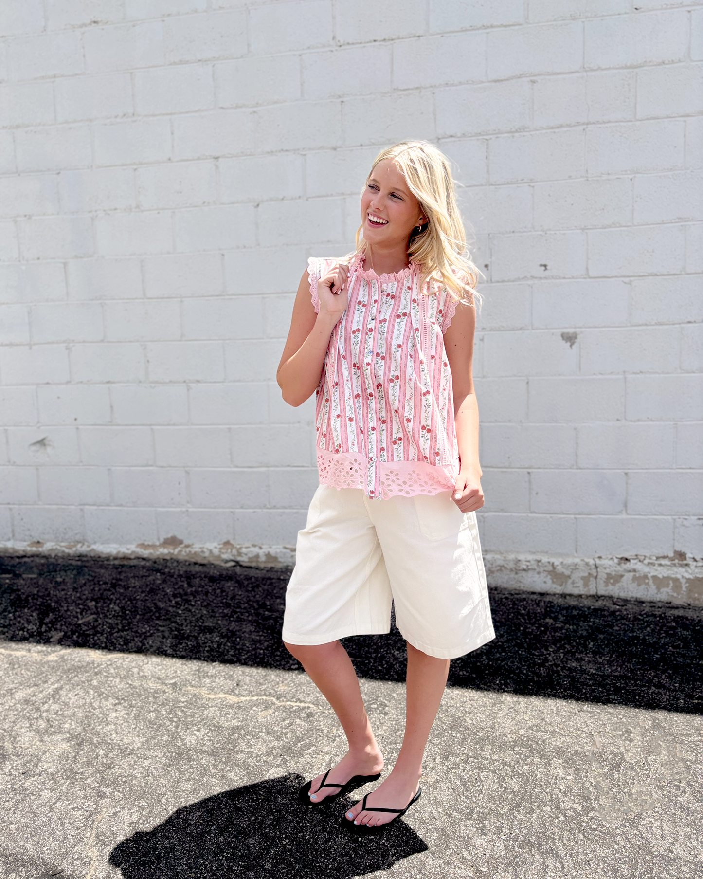 sleeveless top with pink lace trim and floral pink stripes down the front