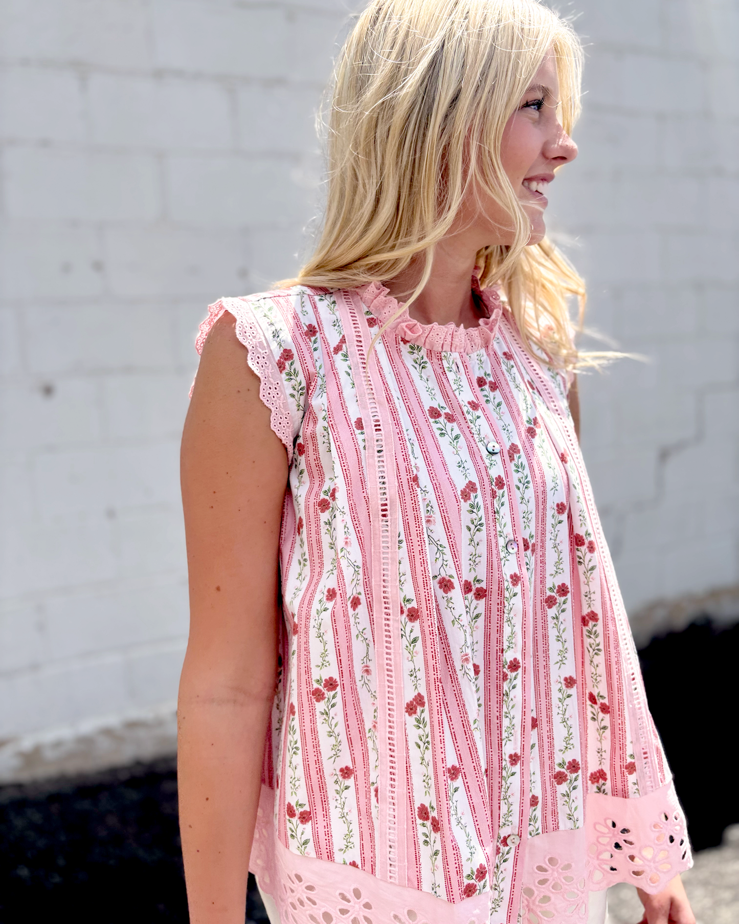 sleeveless top with pink lace trim and floral pink stripes down the front