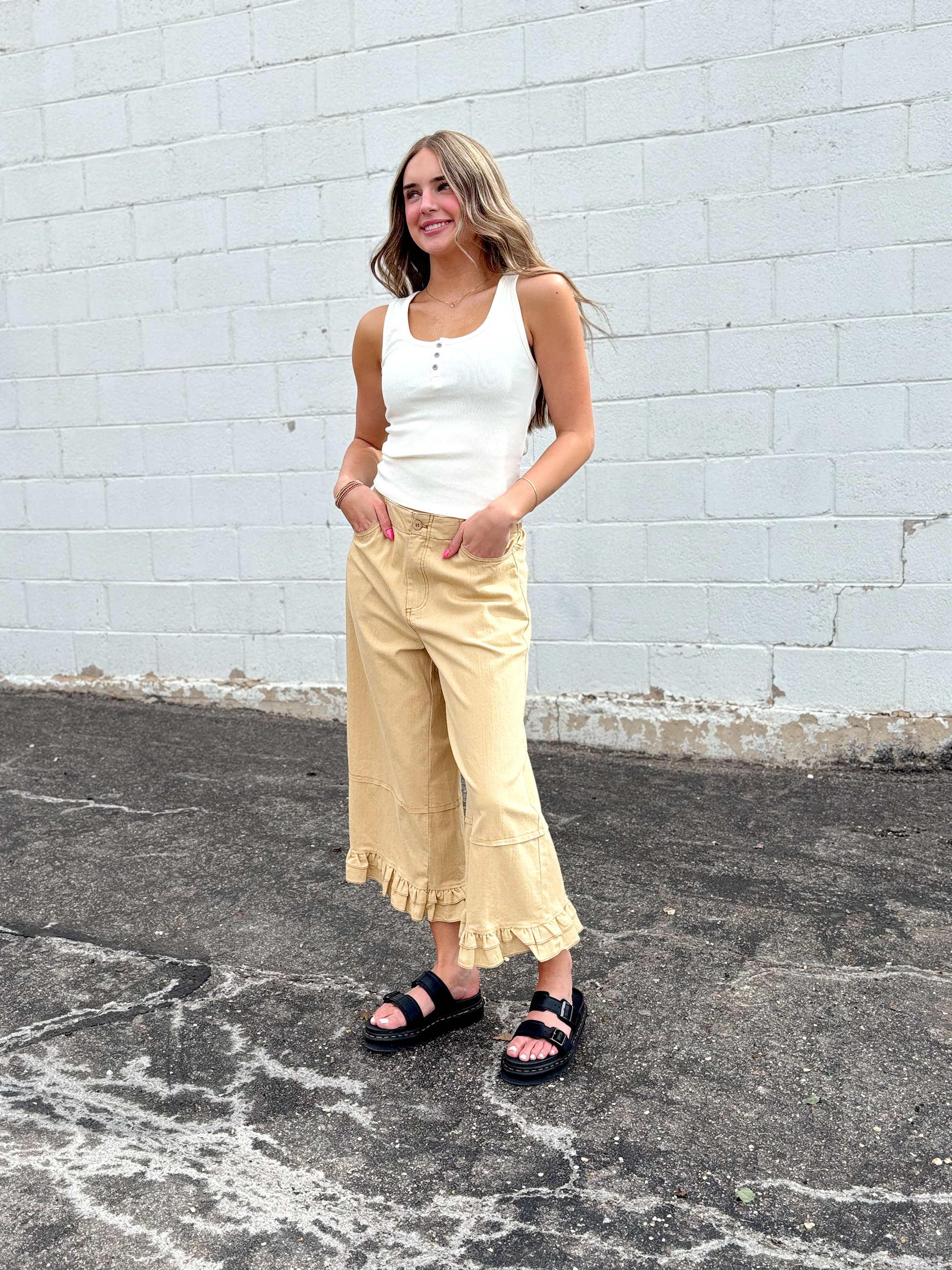 Cute wide leg tan pants with ruffles on the bottom of each leg