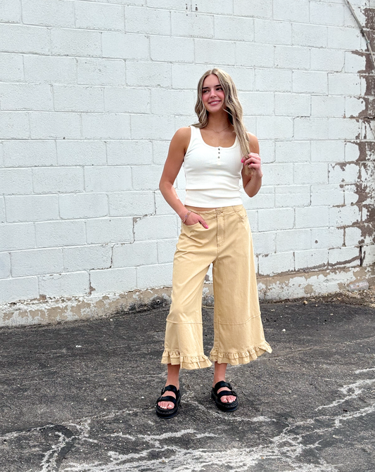 Cute wide leg tan pants with ruffles on the bottom of each leg
