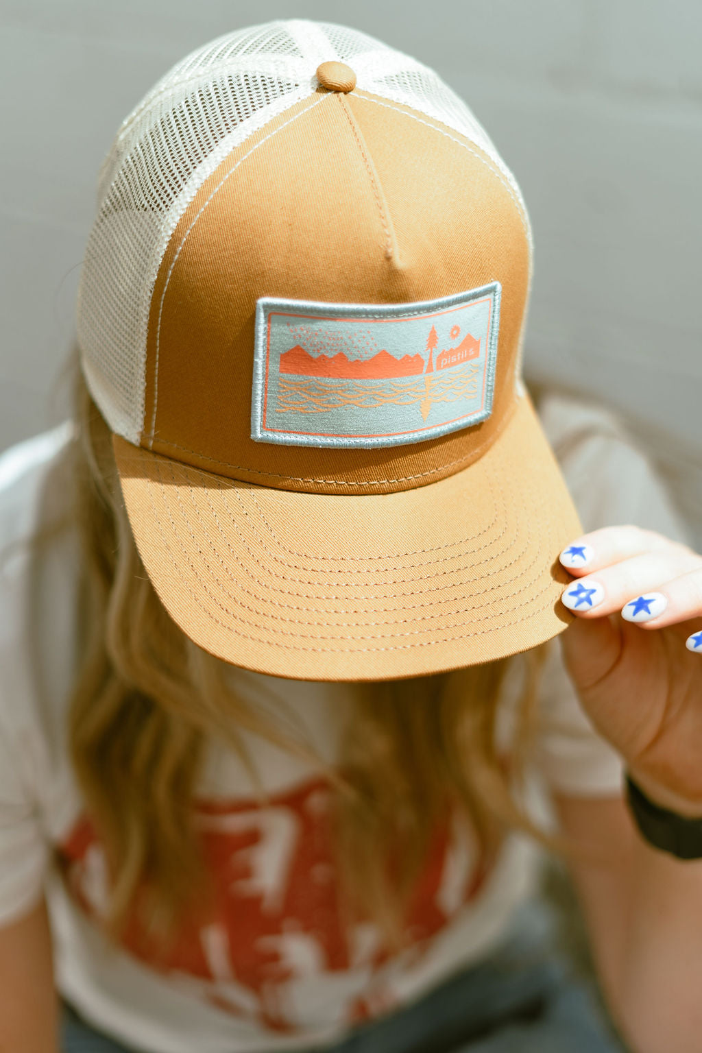 trucker hat in tan and orange