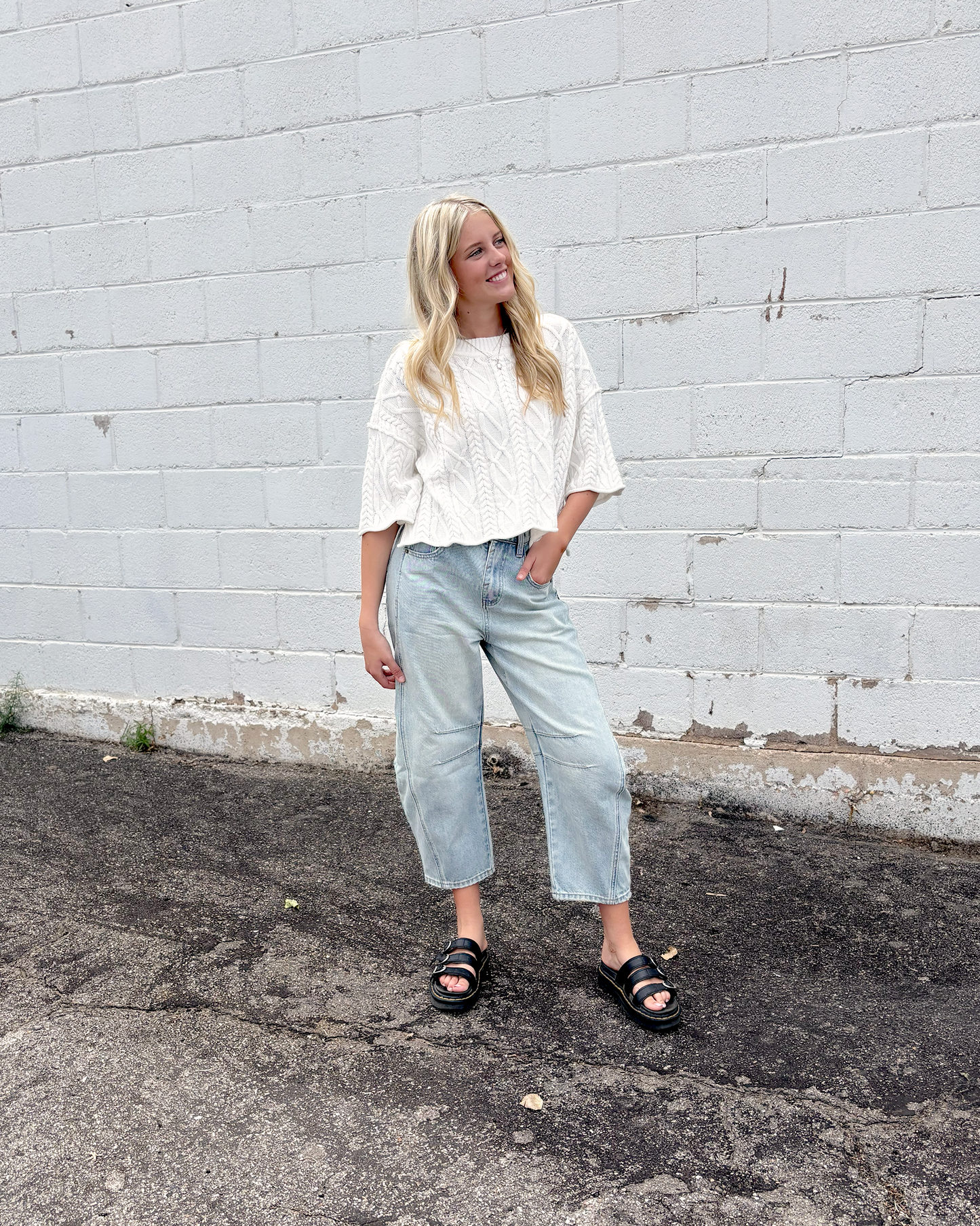 Cute white cropped sweater with short sleeves in a cable knit pattern