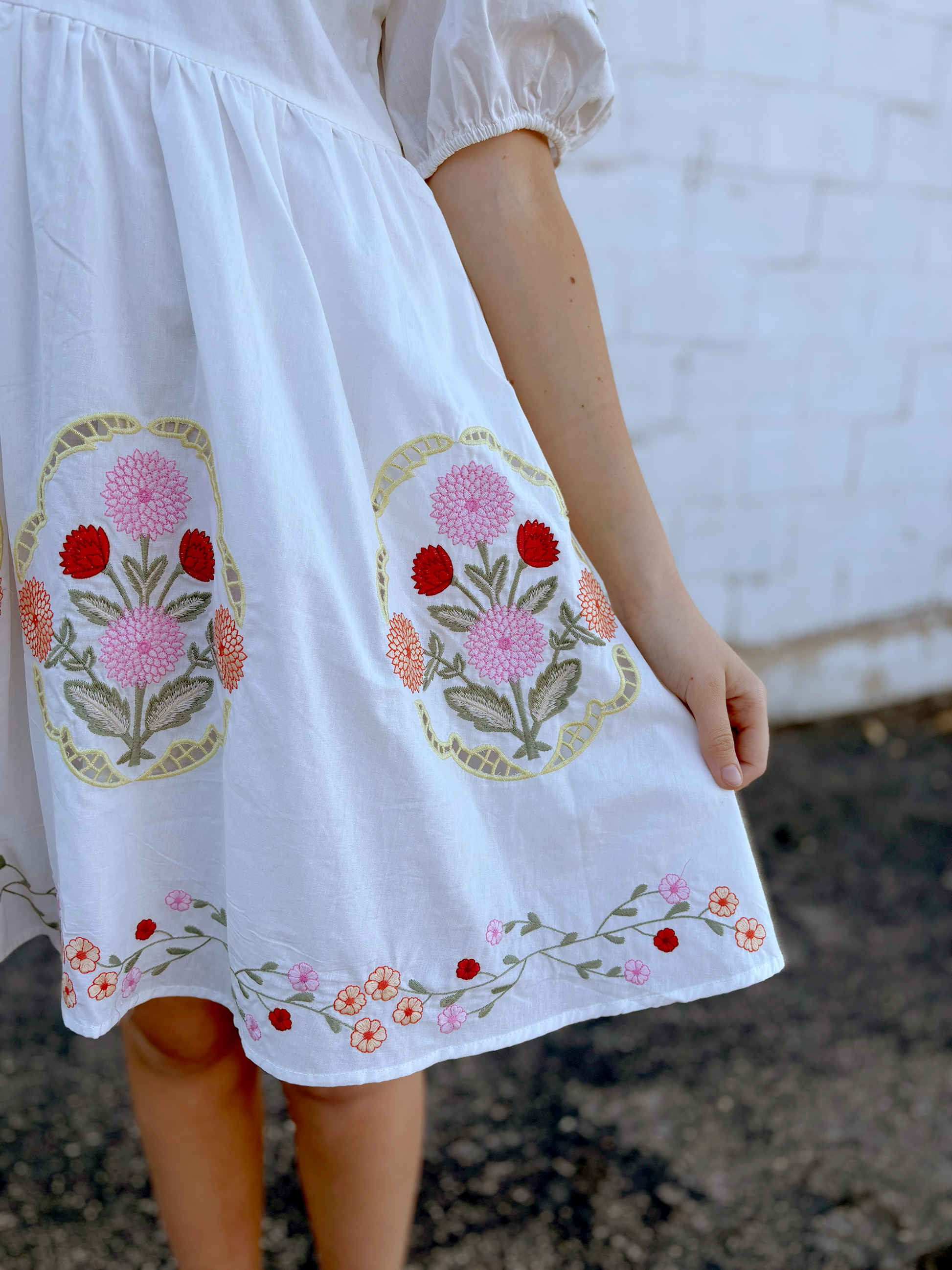 White dress with floral embroidery details
