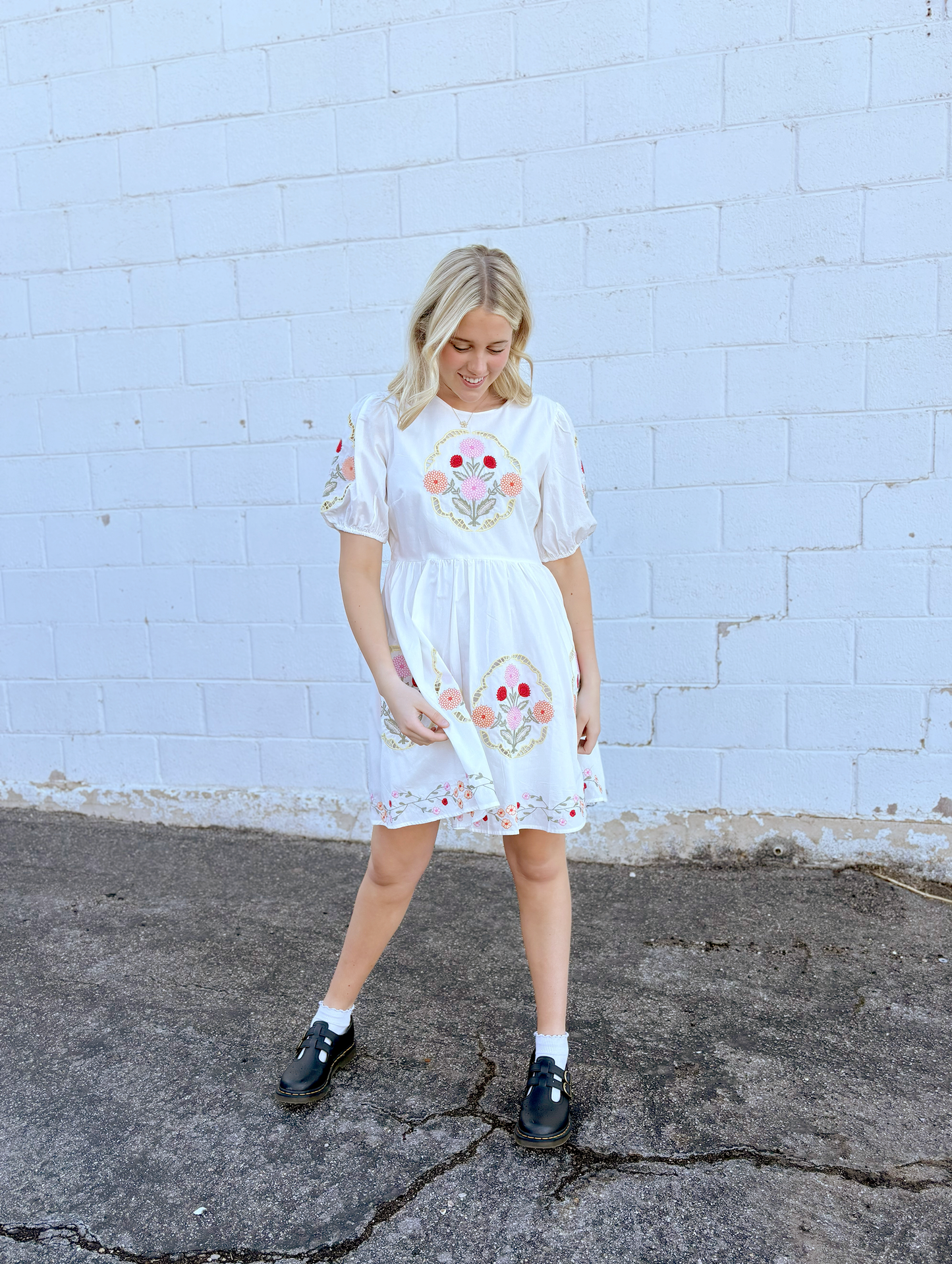 White dress with floral embroidery details