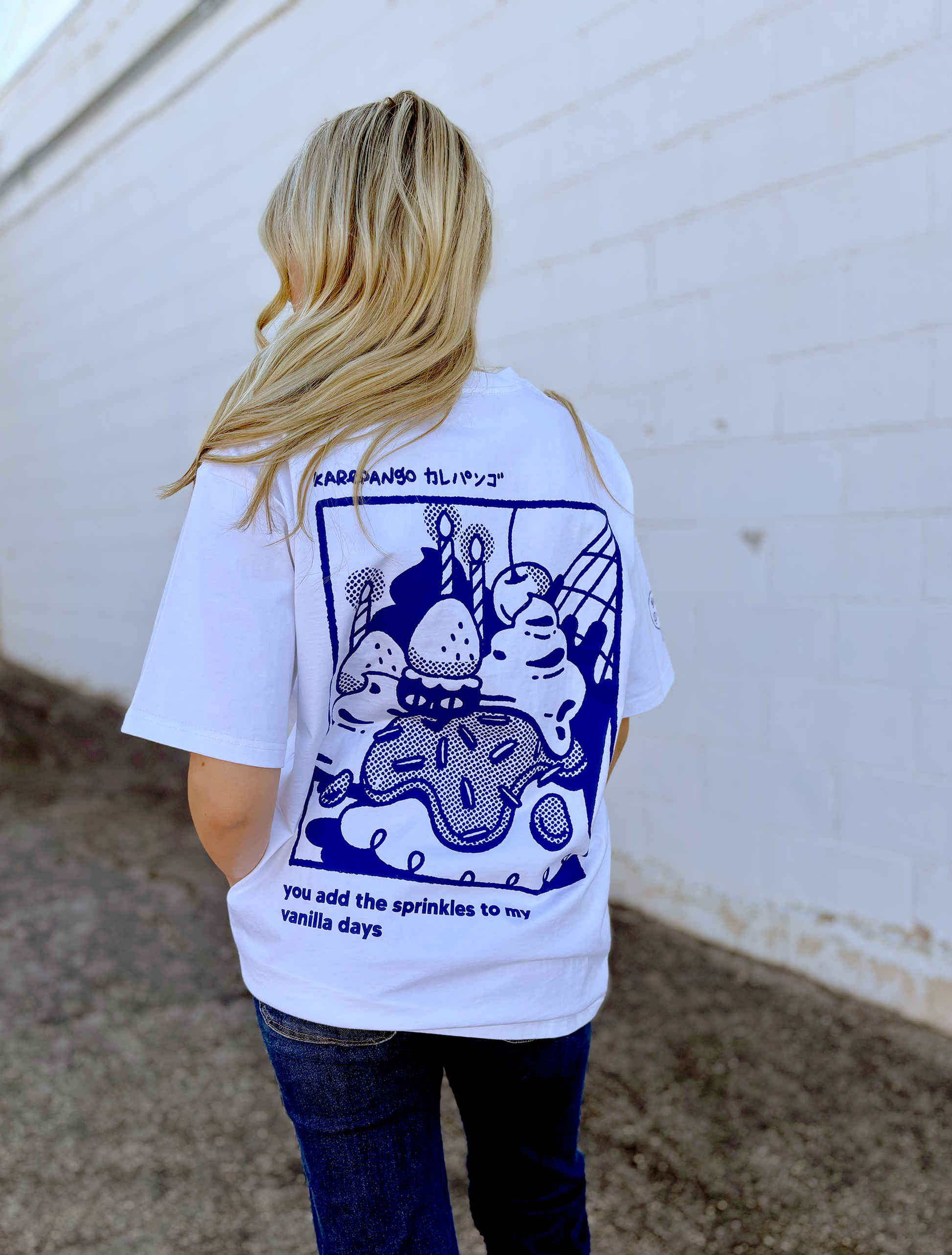 Cute white graphic tee with Japanese character on the front and sleeve and the saying "you add sprinkles to my vanilla days" on the back