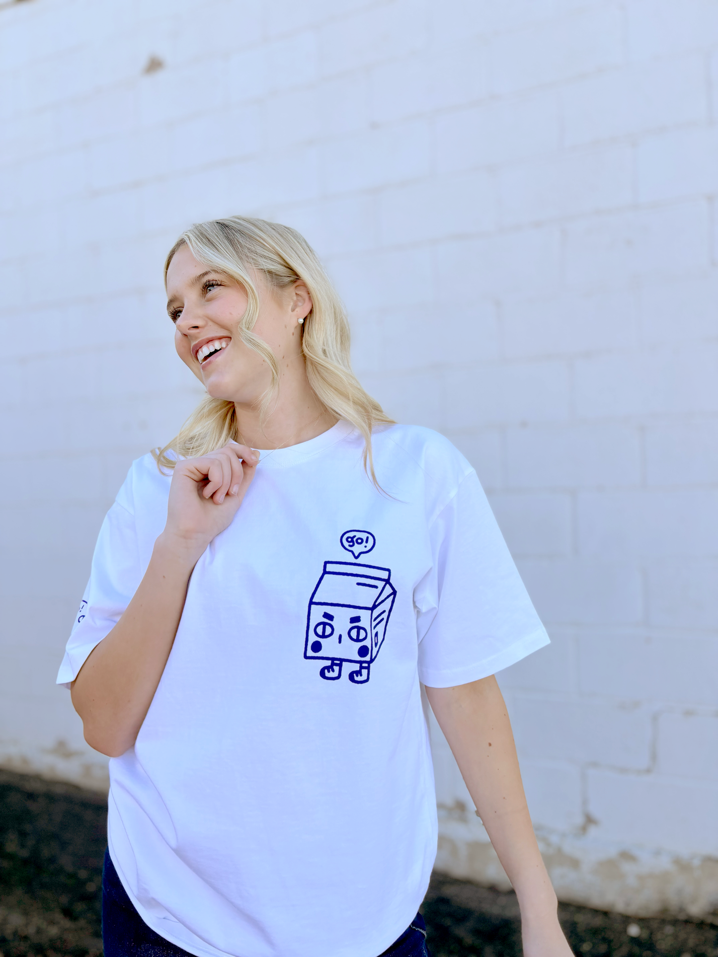 Cute white graphic tee with Japanese character on the front and sleeve and the saying "you add sprinkles to my vanilla days" on the back
