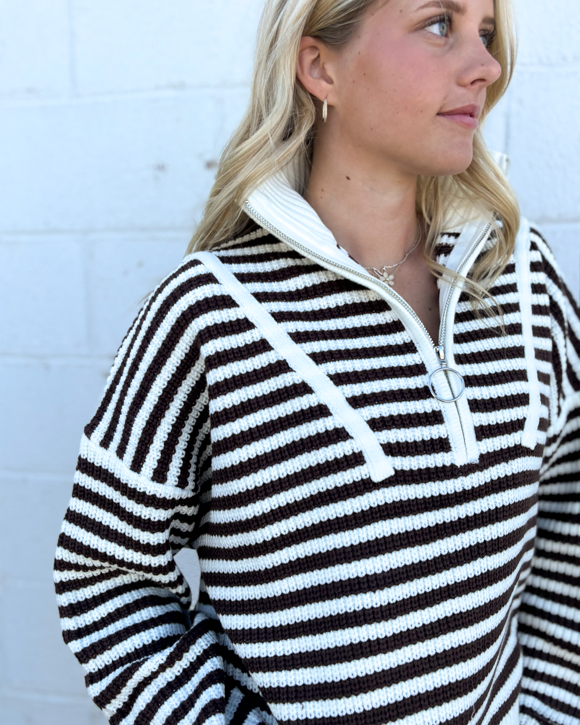 Sweater with mocha colored stripes and a half zip collar