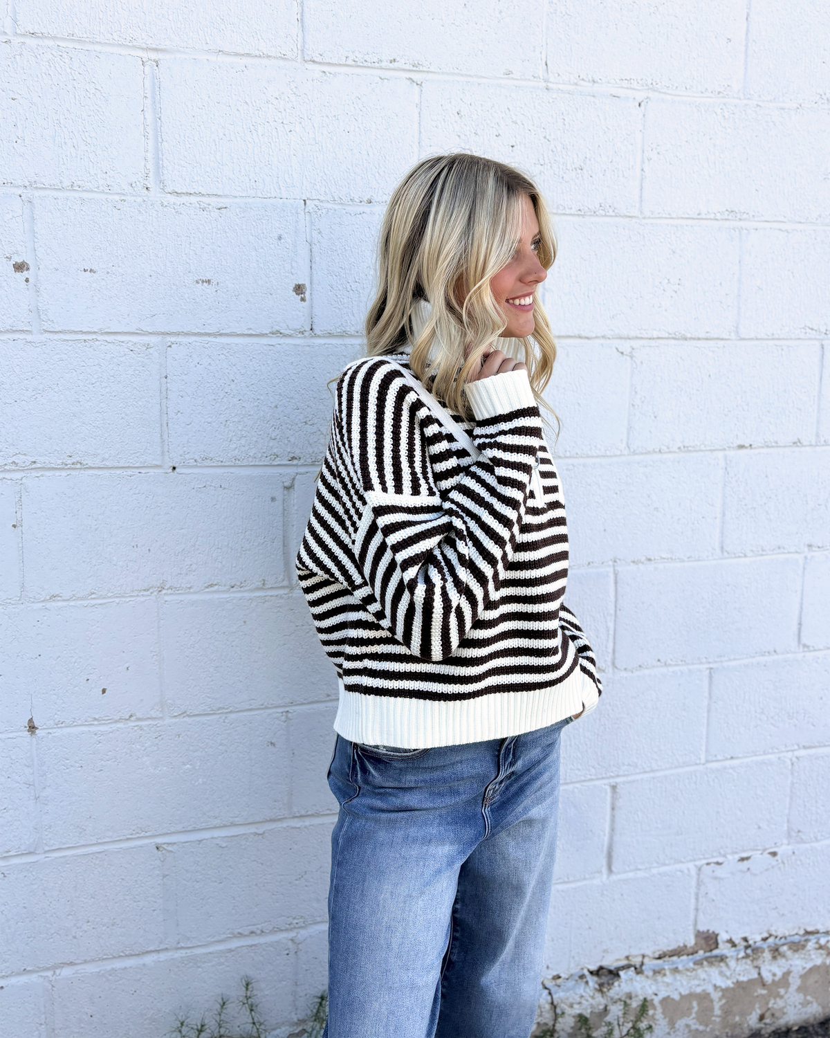 Sweater with mocha colored stripes and a half zip collar